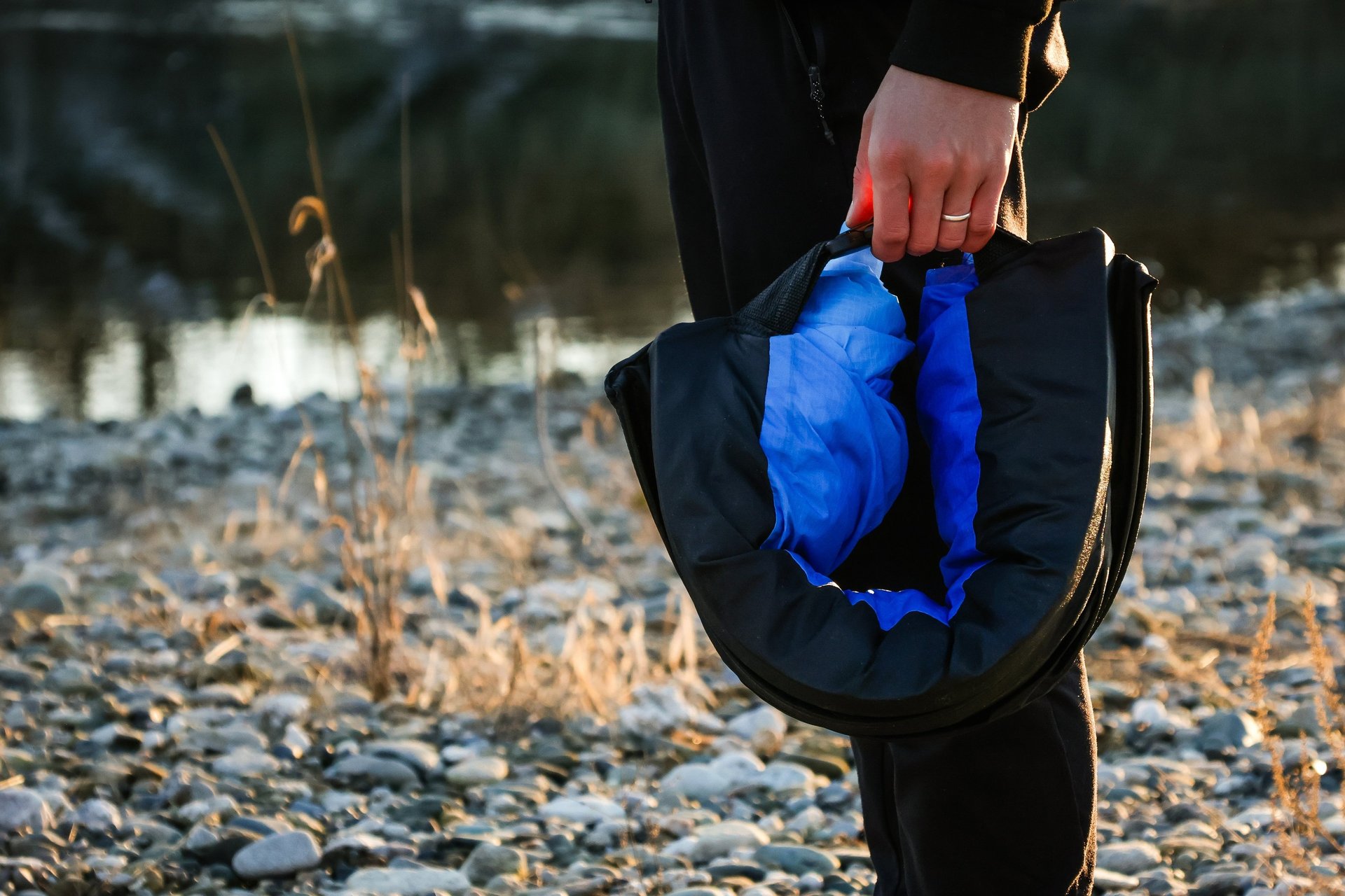 a rack of different colored spools of thread