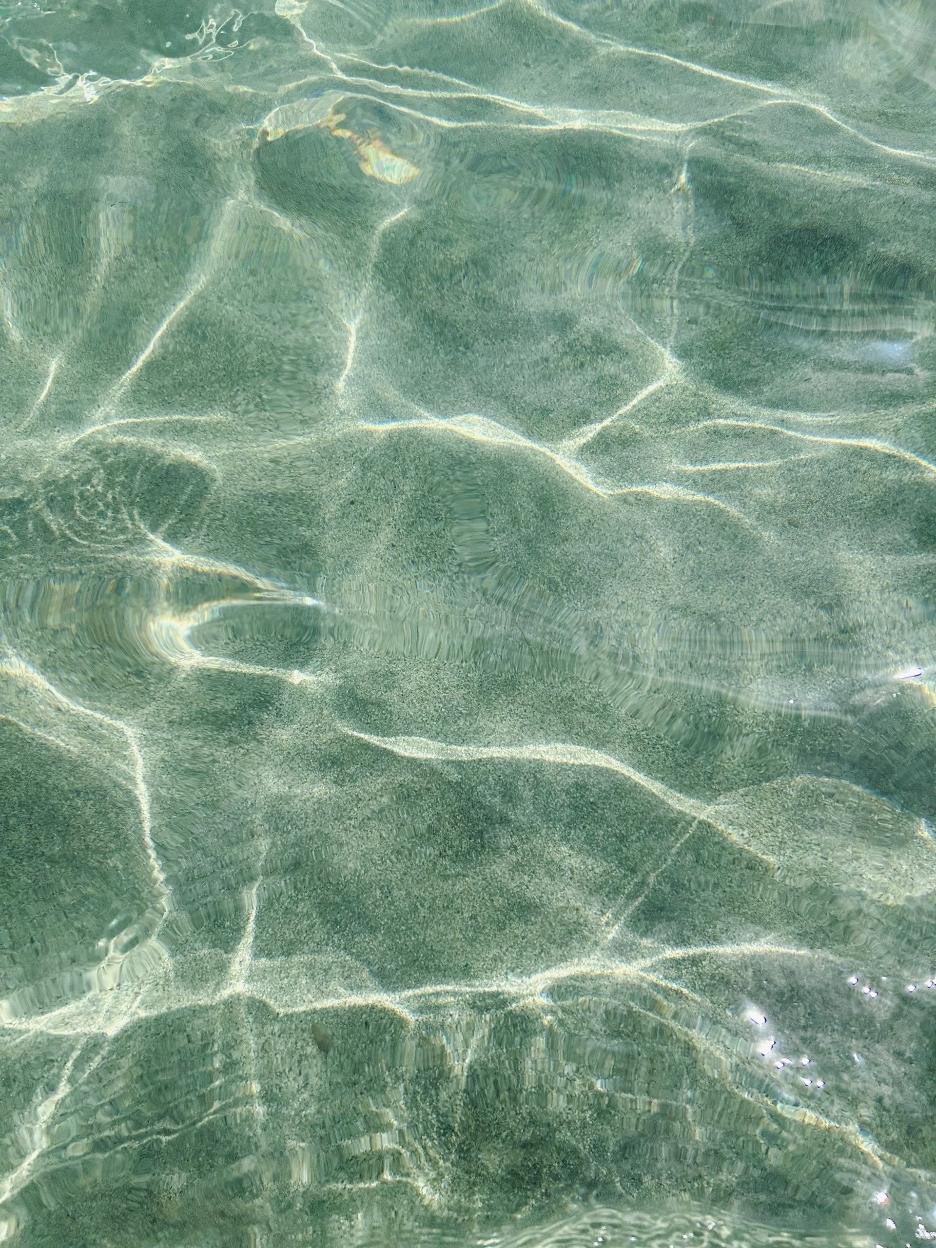 a rack of different colored spools of thread