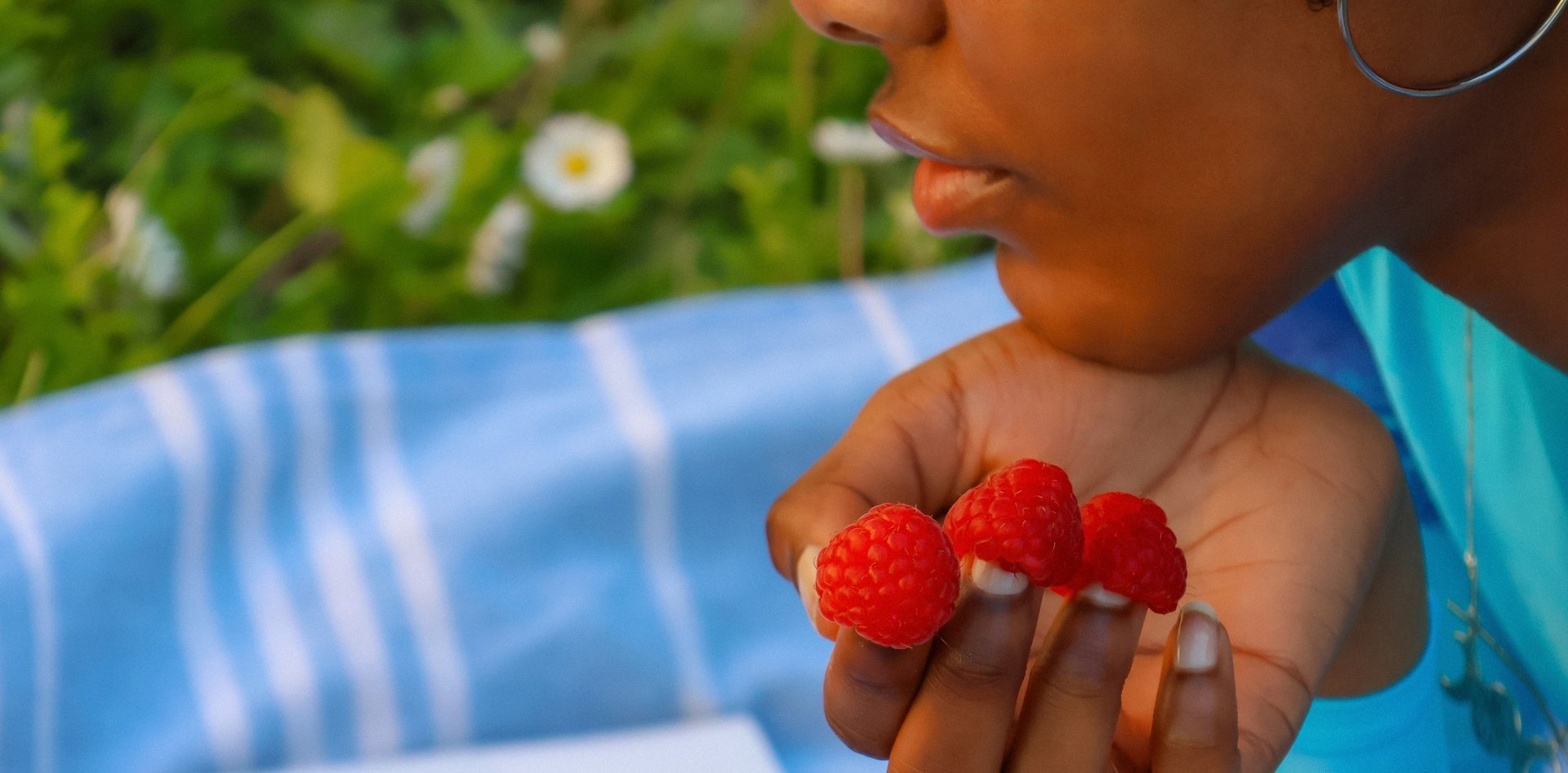 a rack of different colored spools of thread