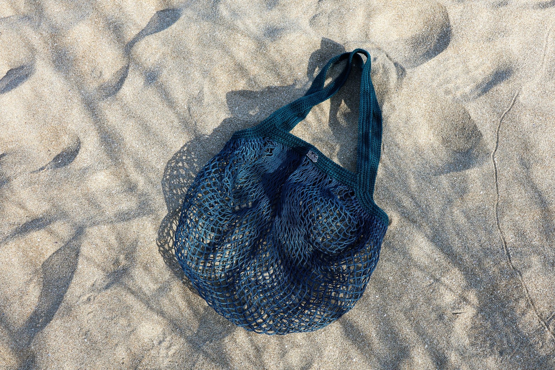 a rack of different colored spools of thread