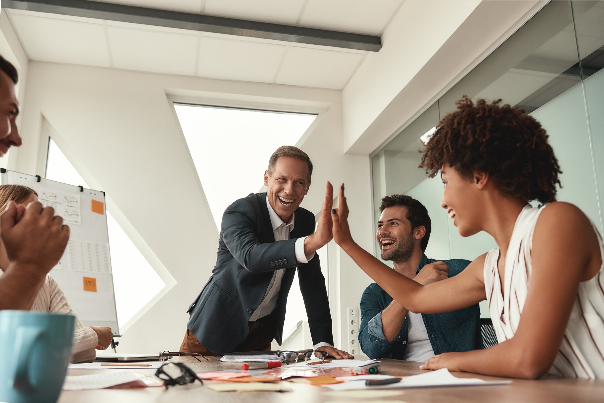 an abstract photo of a curved building with a blue sky in the background
