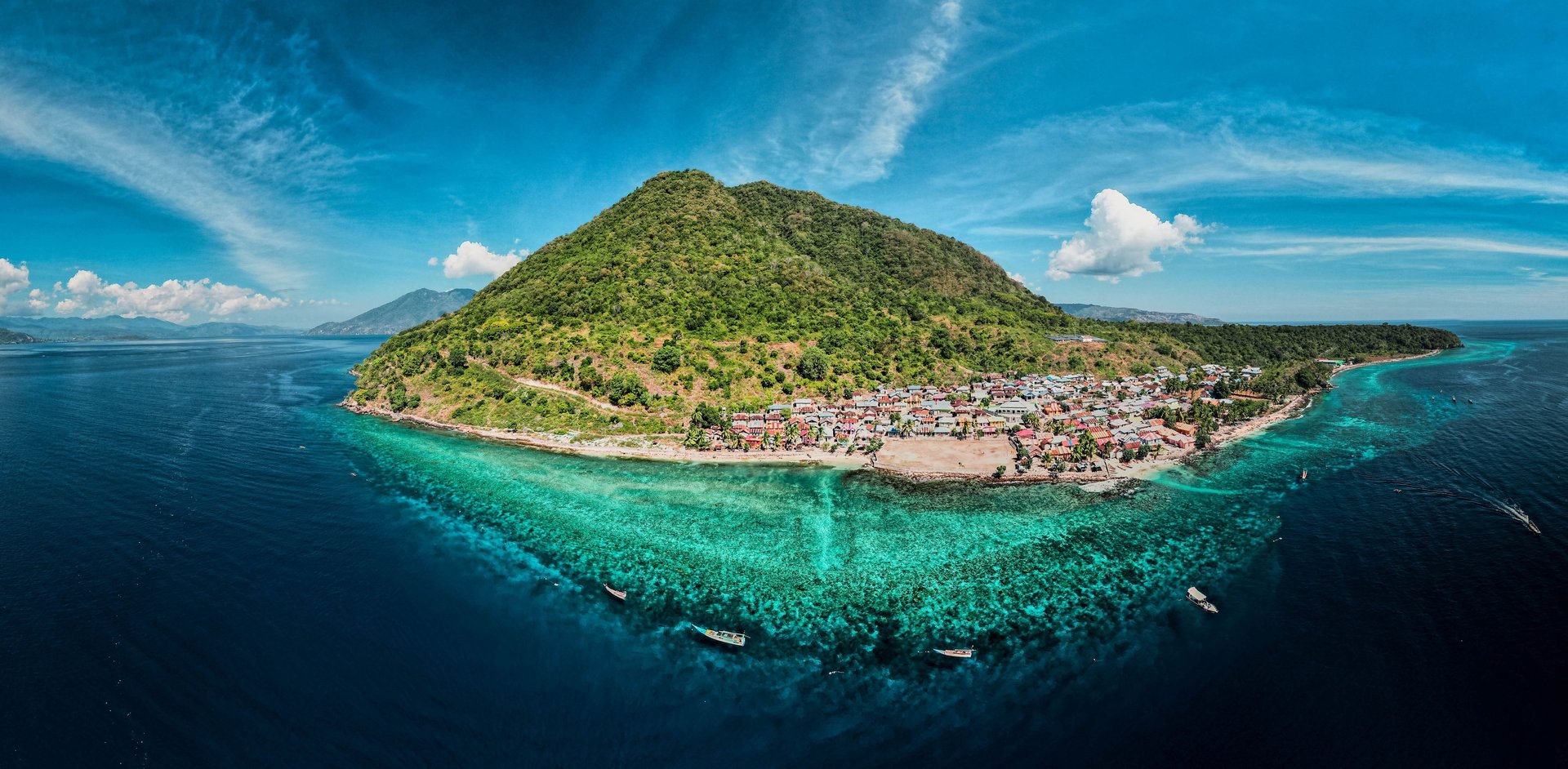 an abstract photo of a curved building with a blue sky in the background