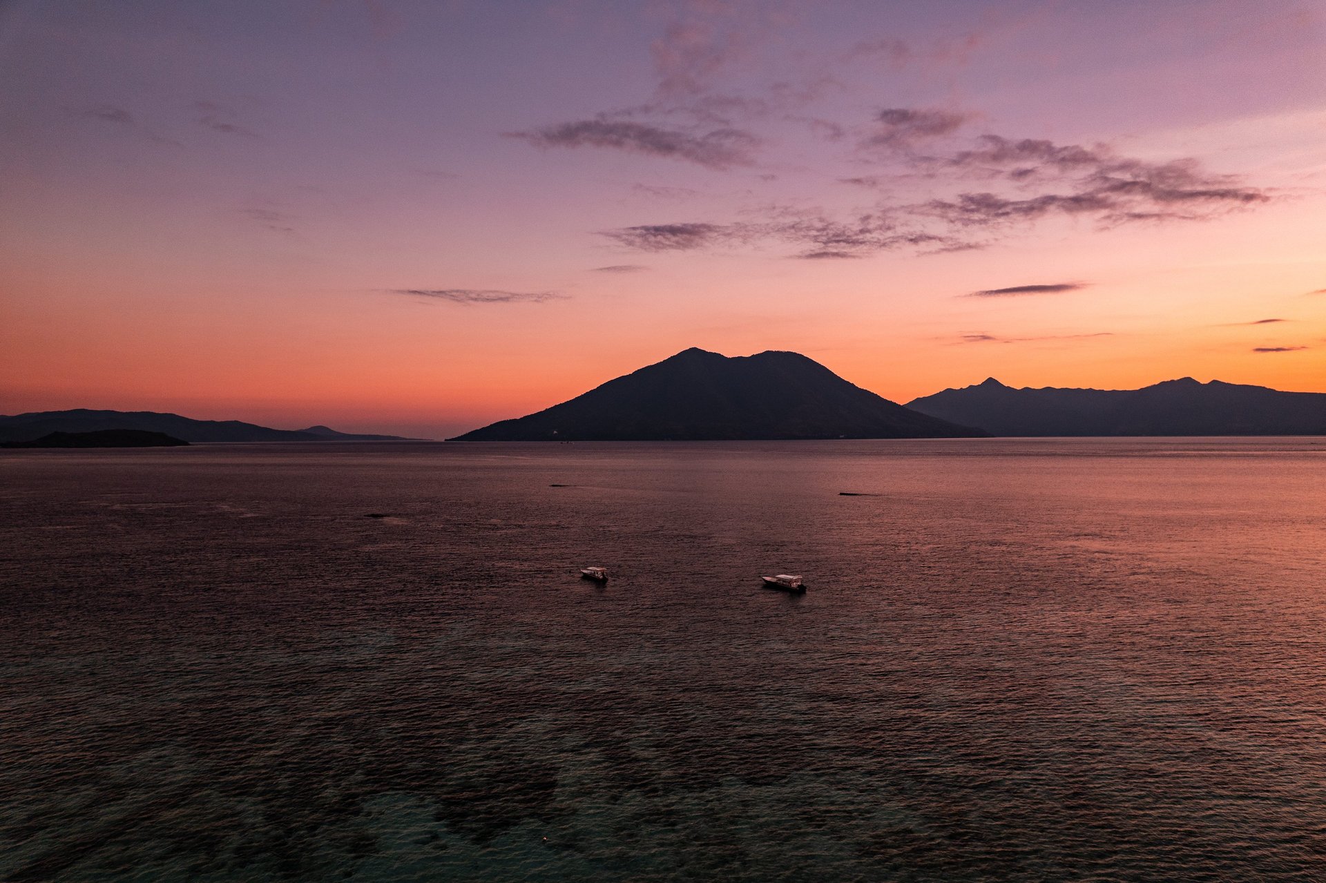 an abstract photo of a curved building with a blue sky in the background