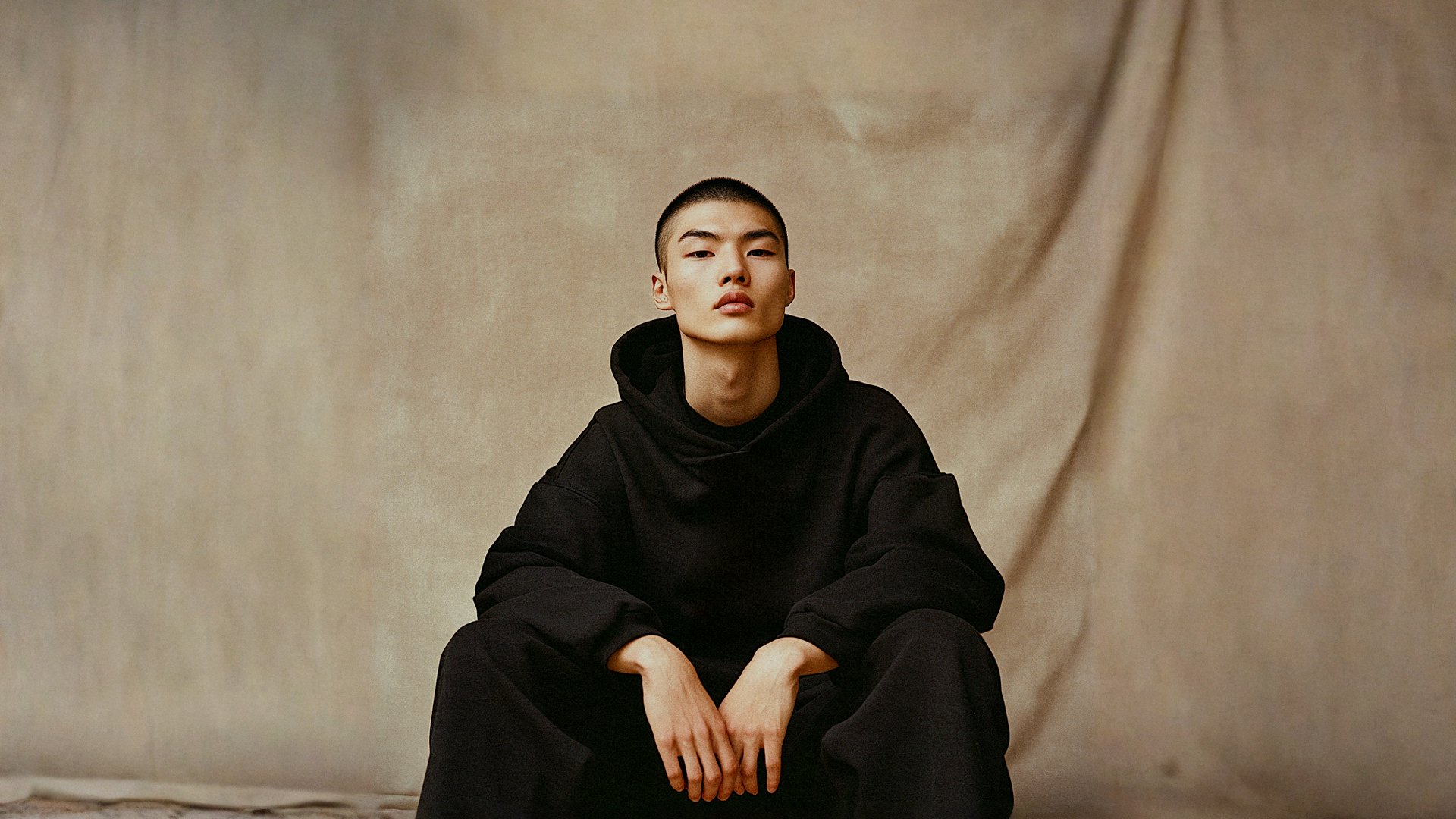 person wearing grey knit sweater