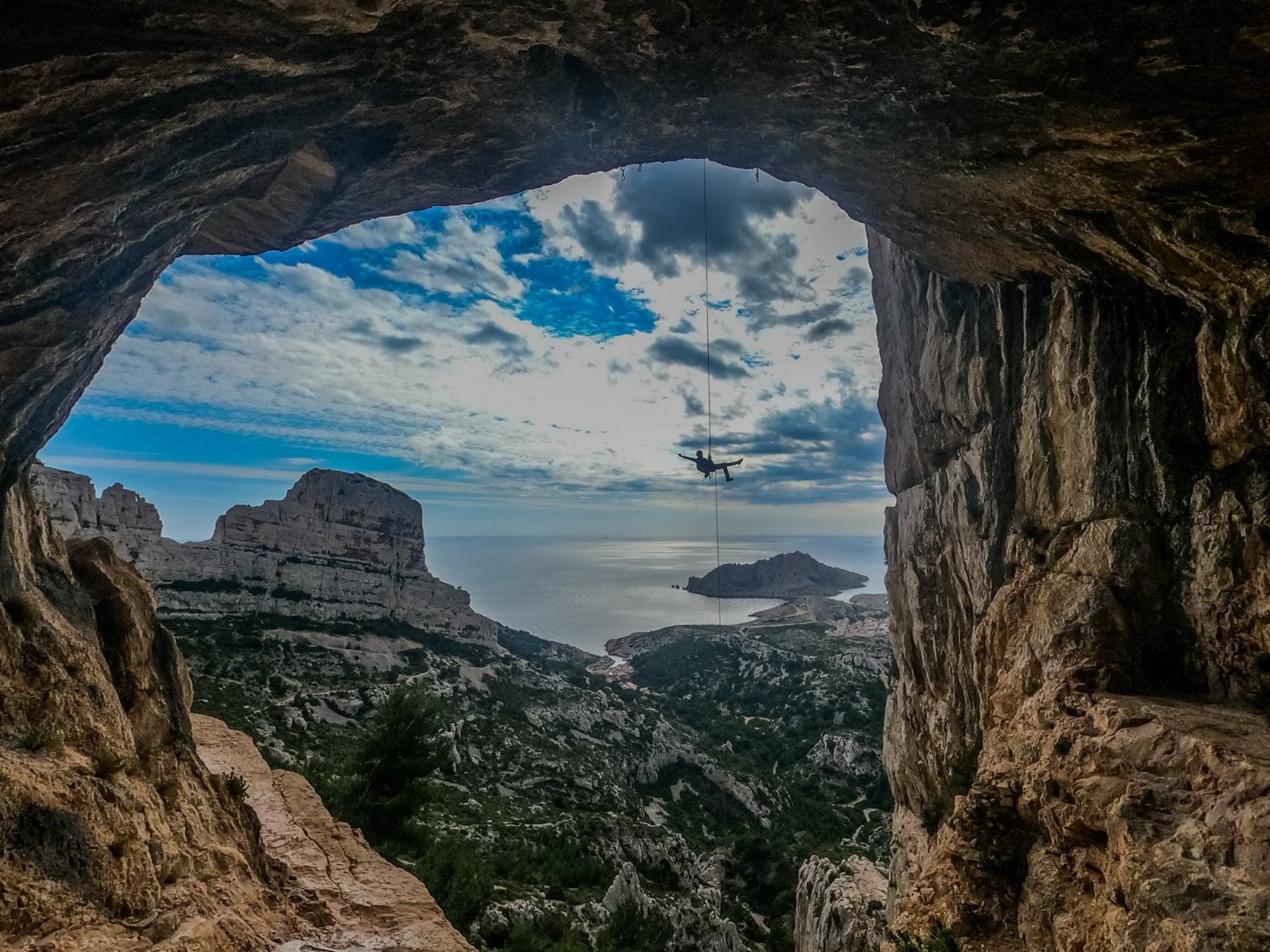 a person standing on top of a large rock
