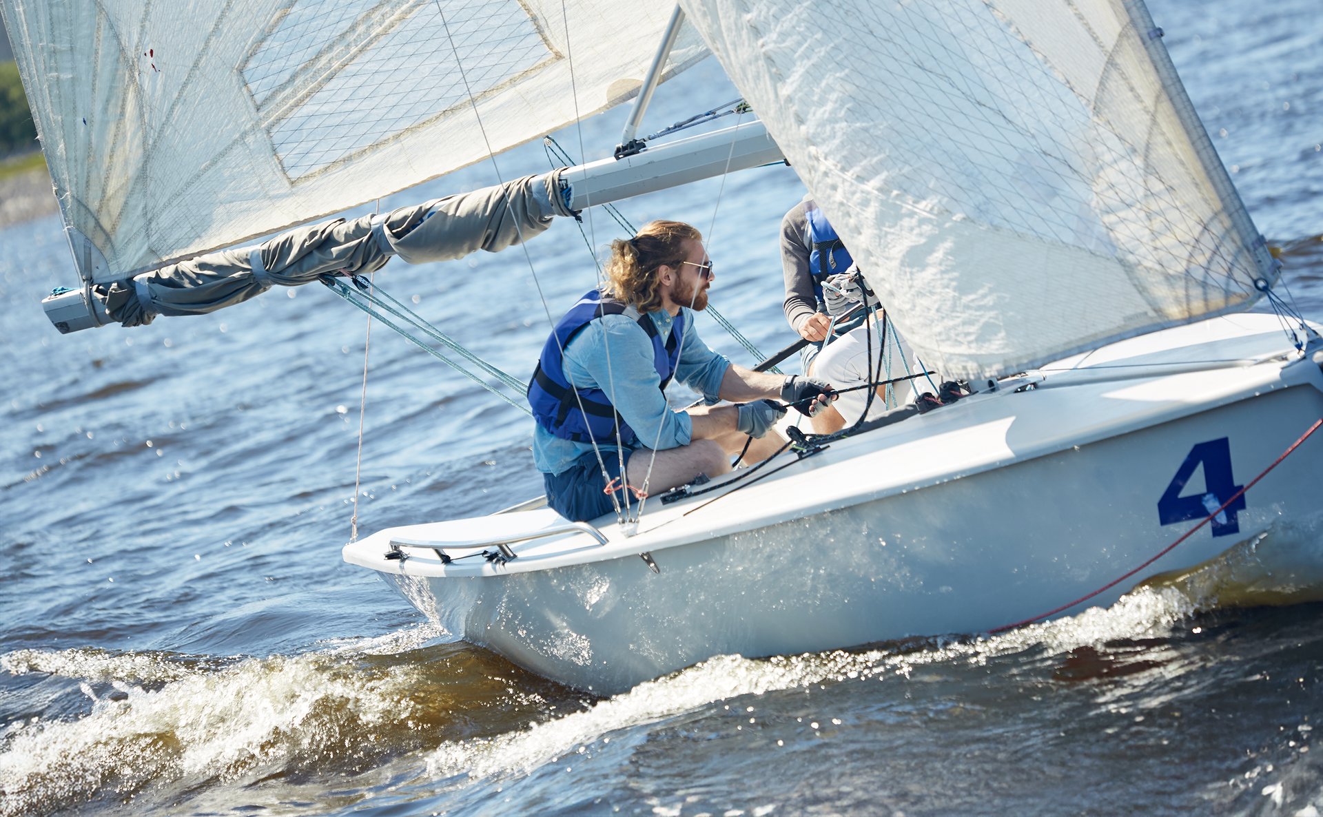 an abstract photo of a curved building with a blue sky in the background
