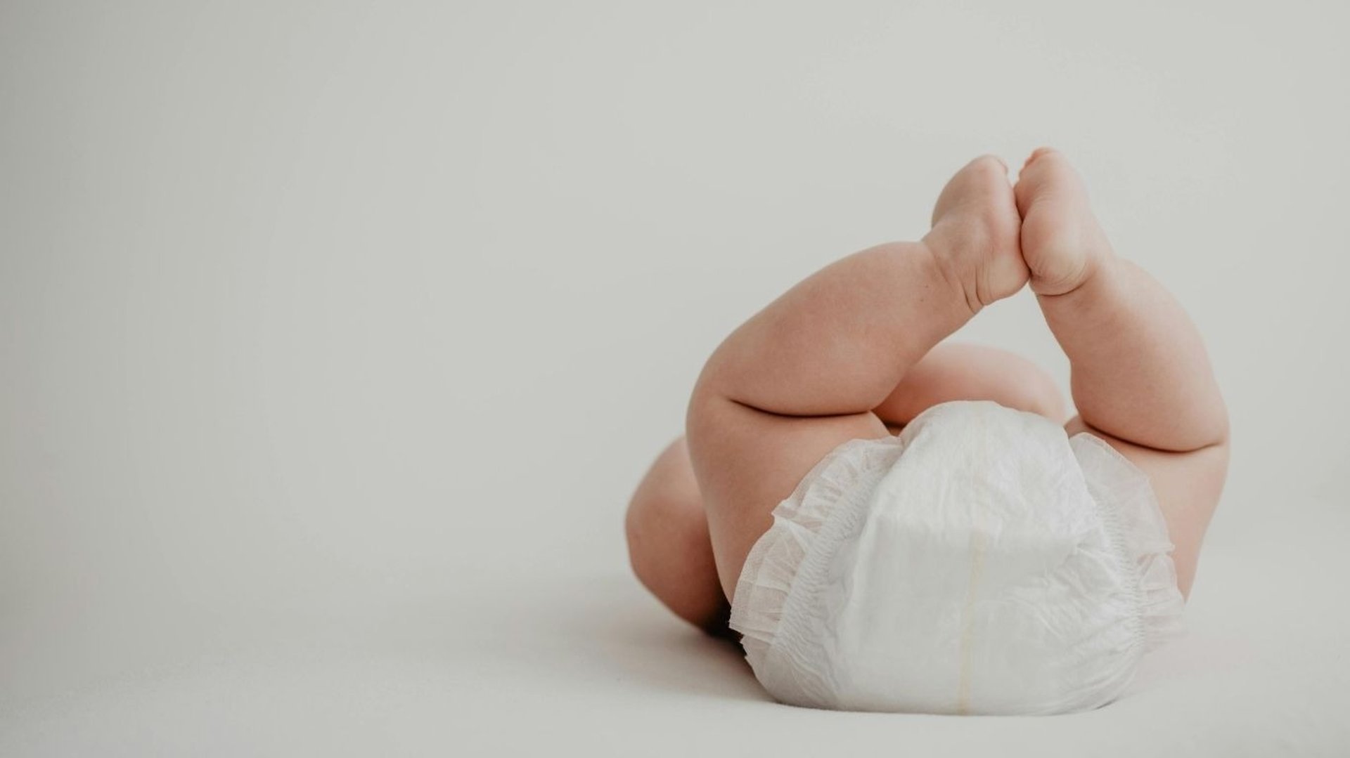 a woman holding a baby in her arms