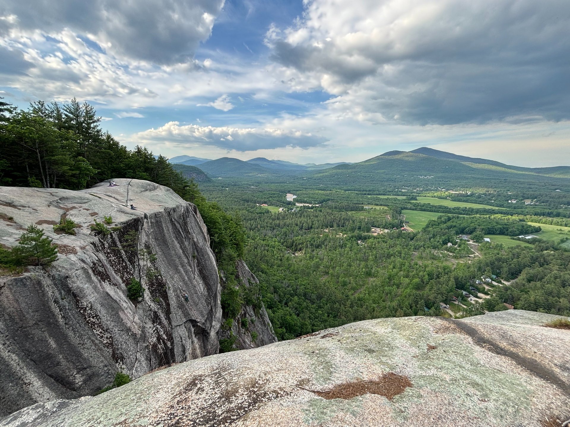photo of woman climbing mountain