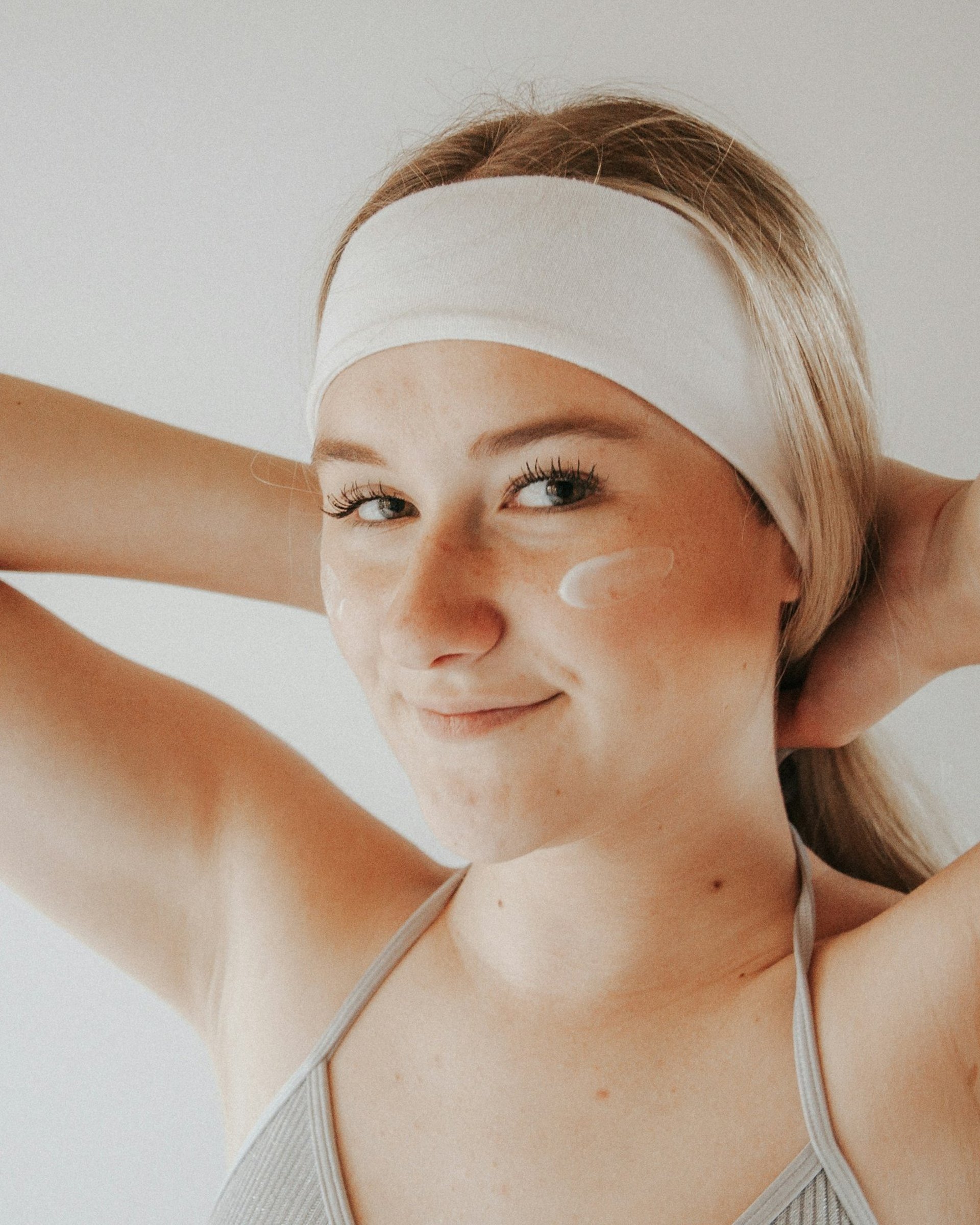 a close up of a person wearing a tank top