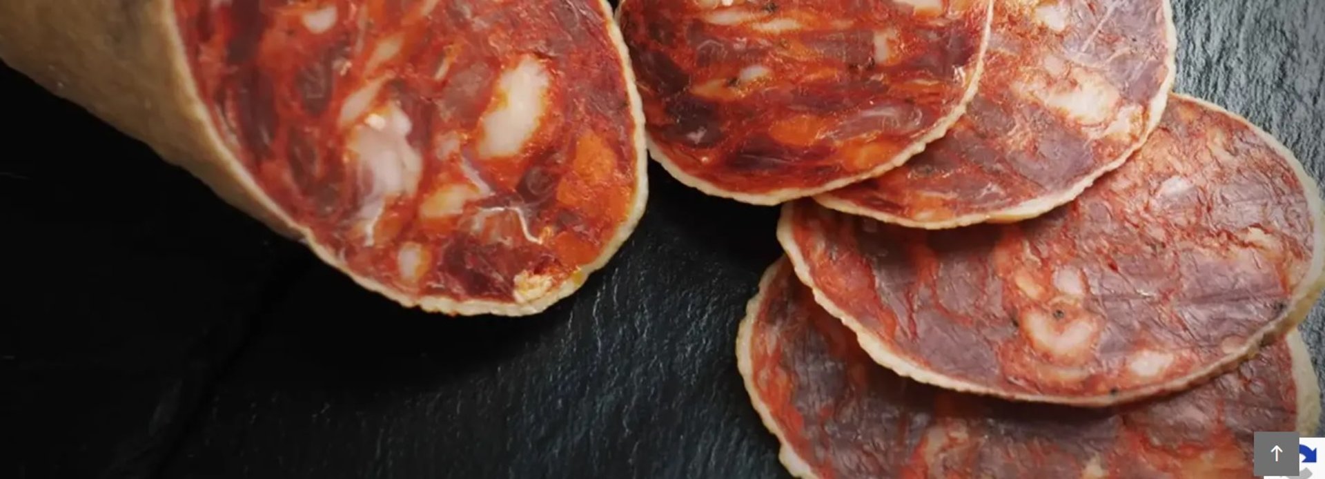 person slicing meat