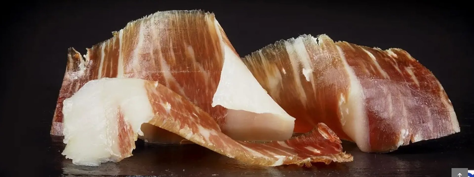 person slicing meat