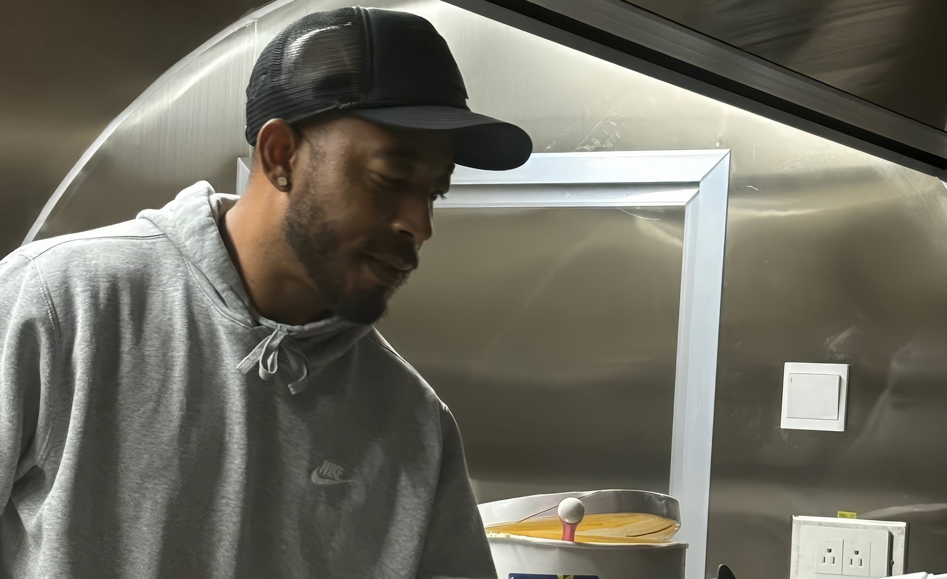 person wearing grey knit sweater