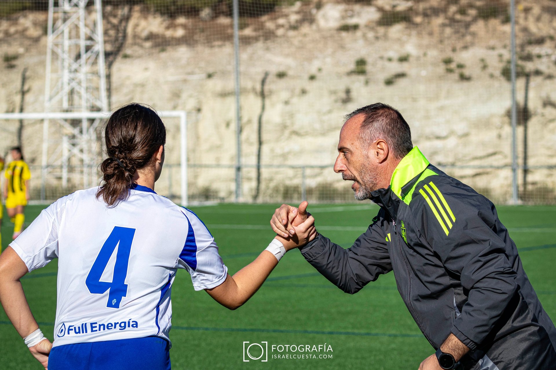woman wearing yellow long-sleeved dress under white clouds and blue sky during daytime