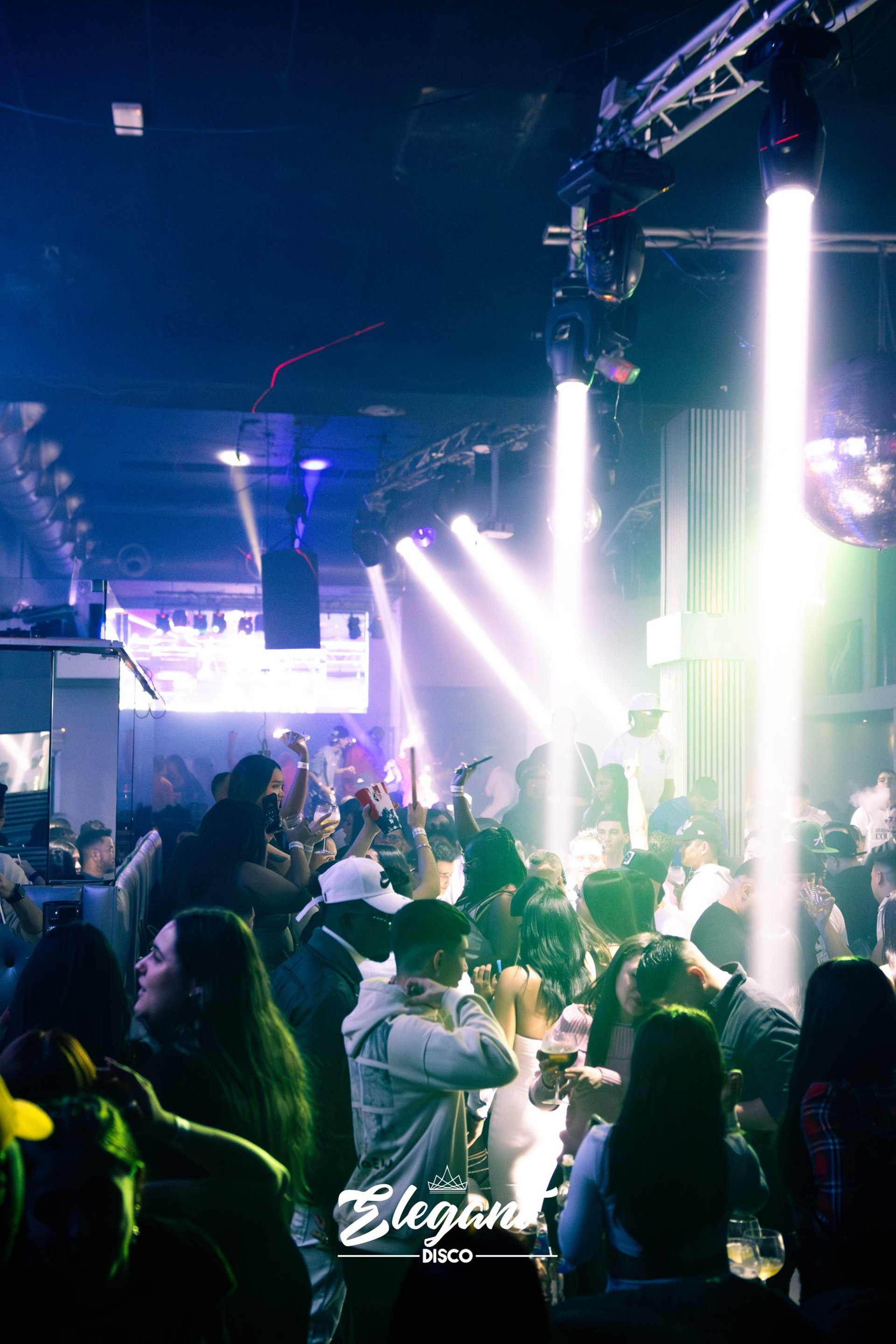 an abstract photo of a curved building with a blue sky in the background