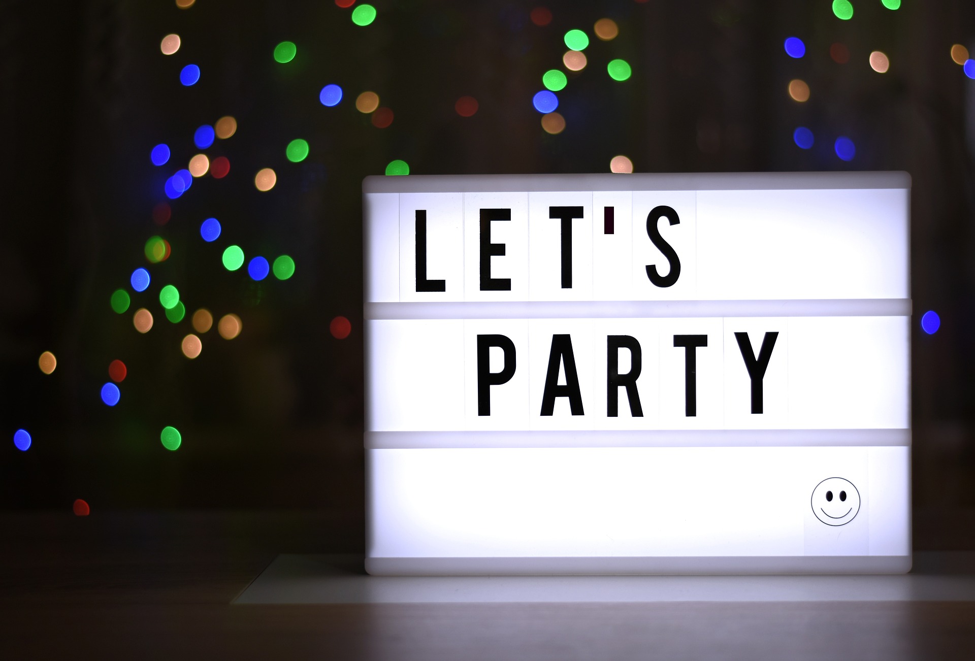 a light board that reads let's party