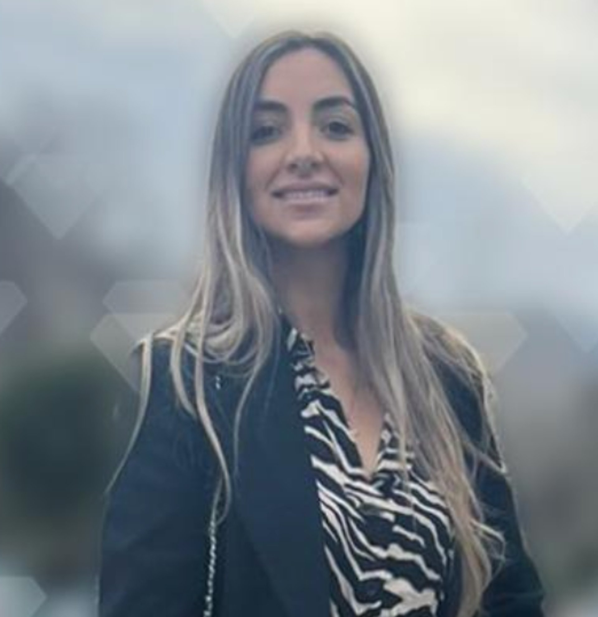 an abstract photo of a curved building with a blue sky in the background