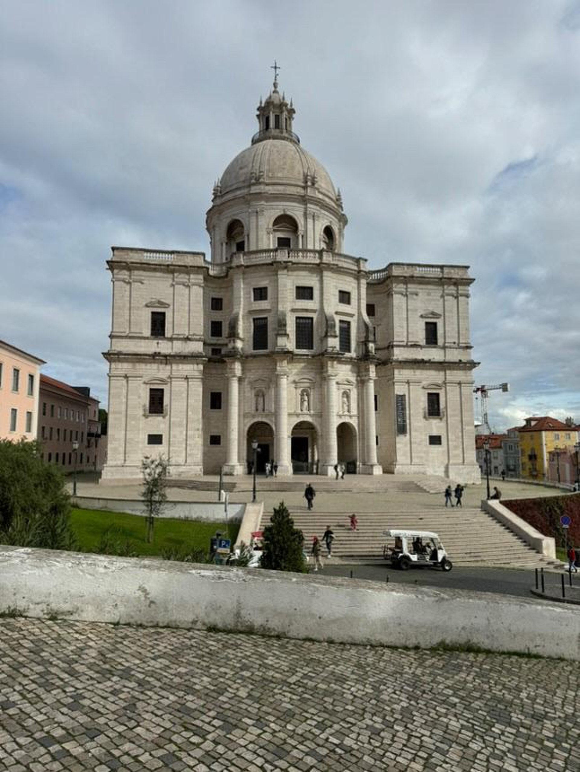 woman wearing yellow long-sleeved dress under white clouds and blue sky during daytime
