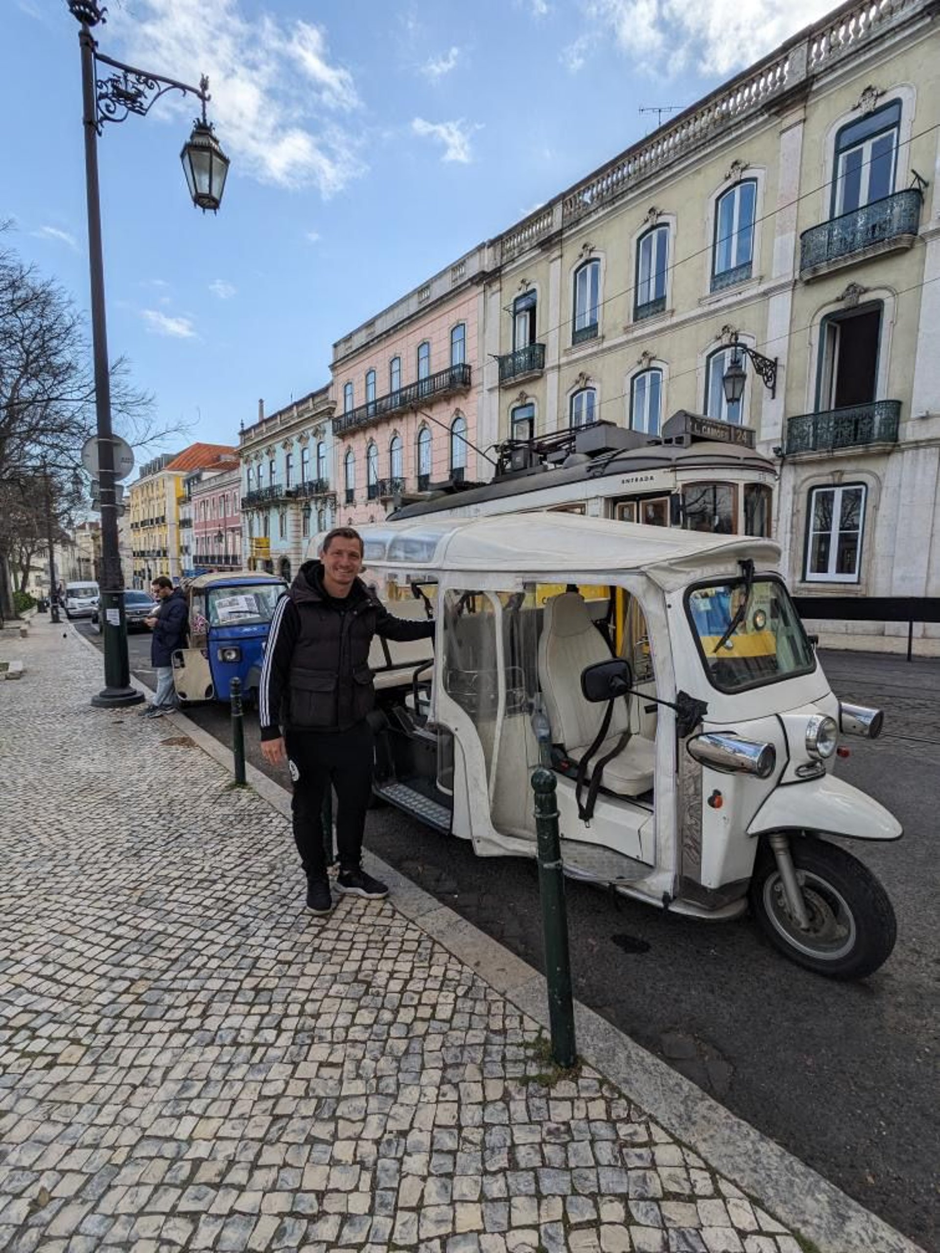woman wearing yellow long-sleeved dress under white clouds and blue sky during daytime