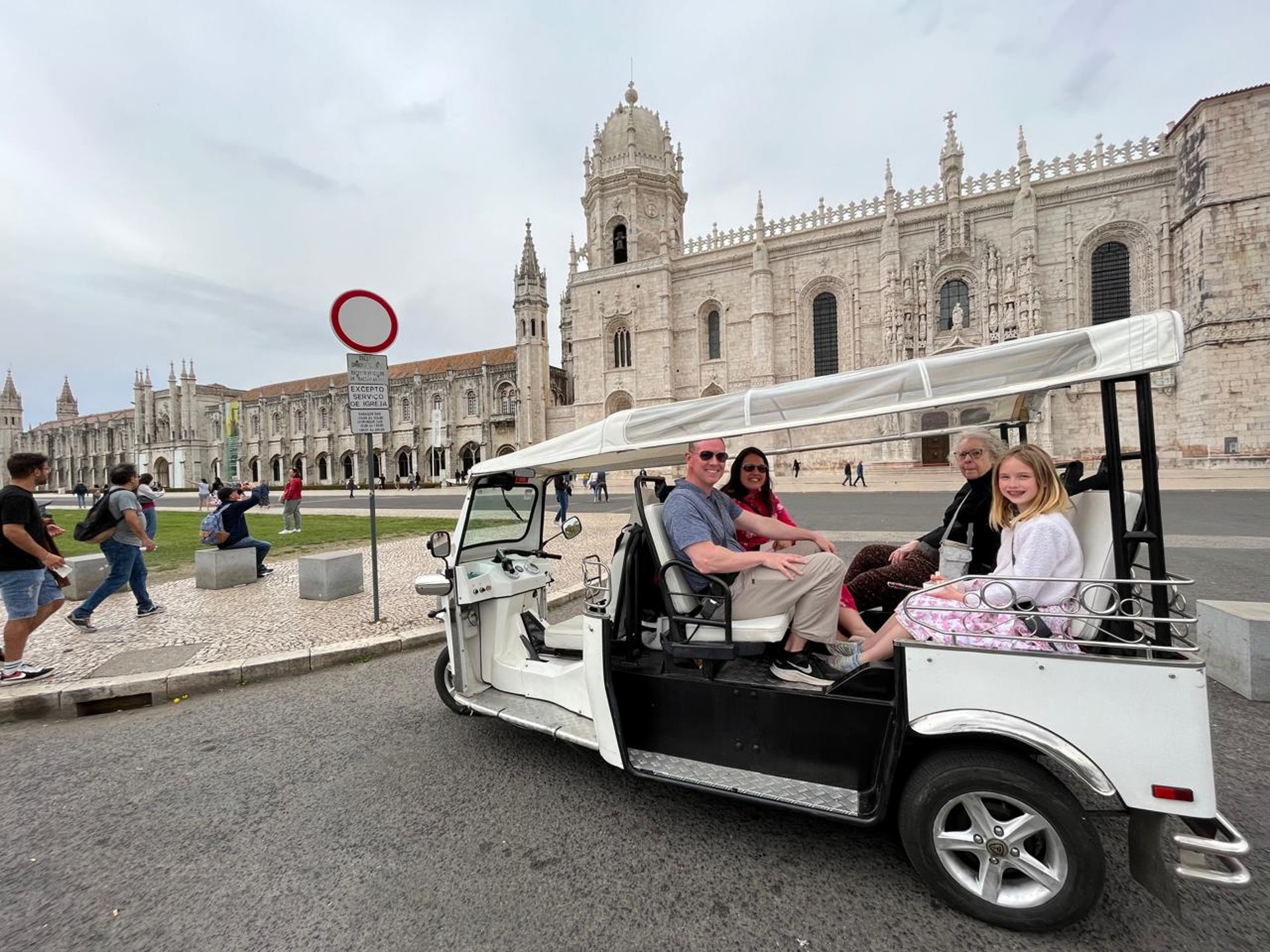 woman wearing yellow long-sleeved dress under white clouds and blue sky during daytime