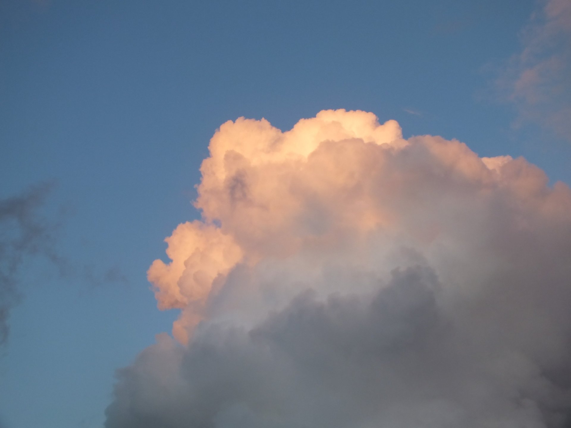 woman wearing yellow long-sleeved dress under white clouds and blue sky during daytime