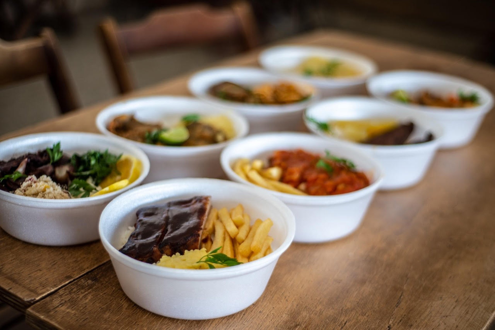woman wearing yellow long-sleeved dress under white clouds and blue sky during daytime