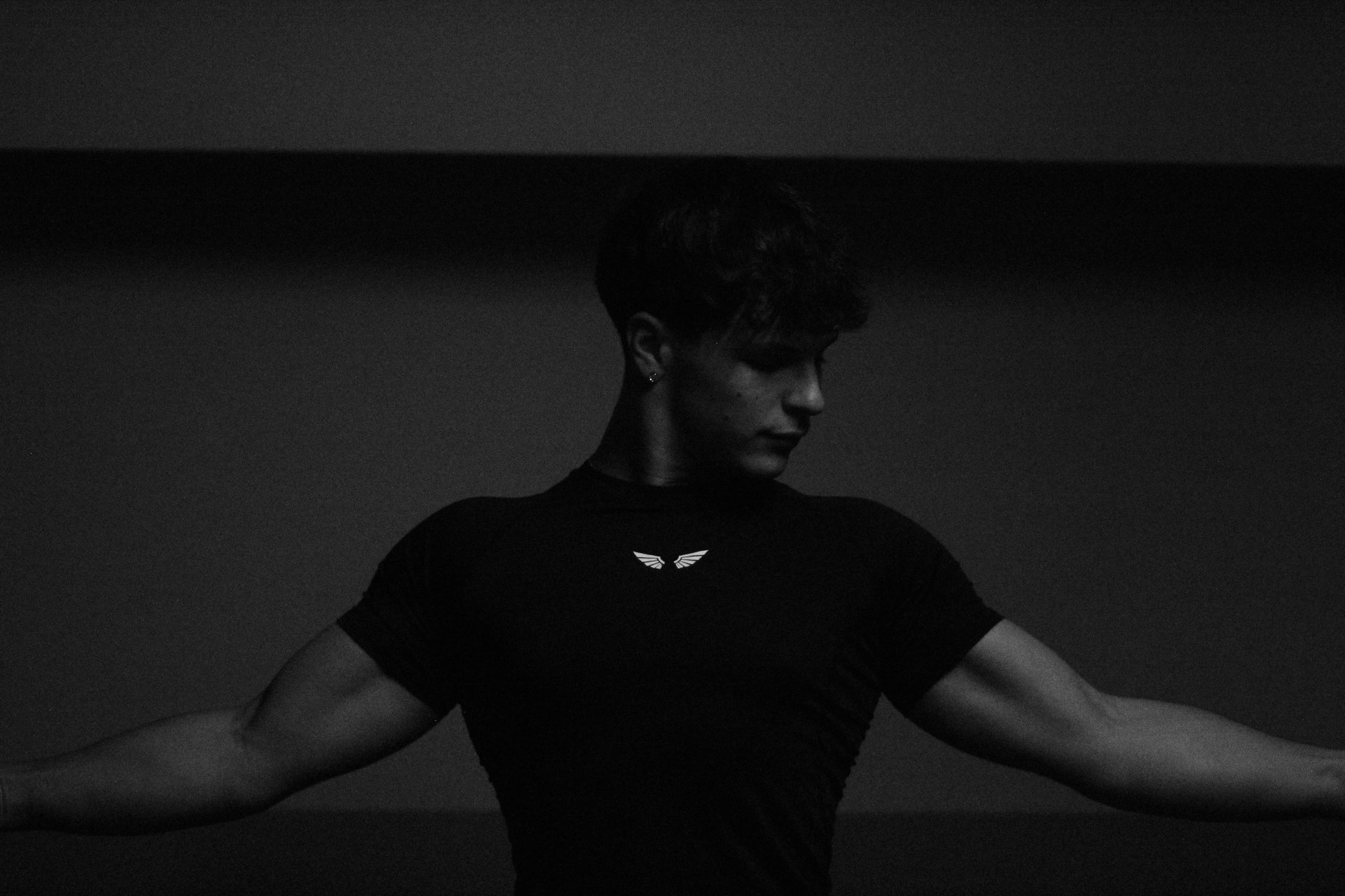 woman in black tank top and red shorts doing exercise