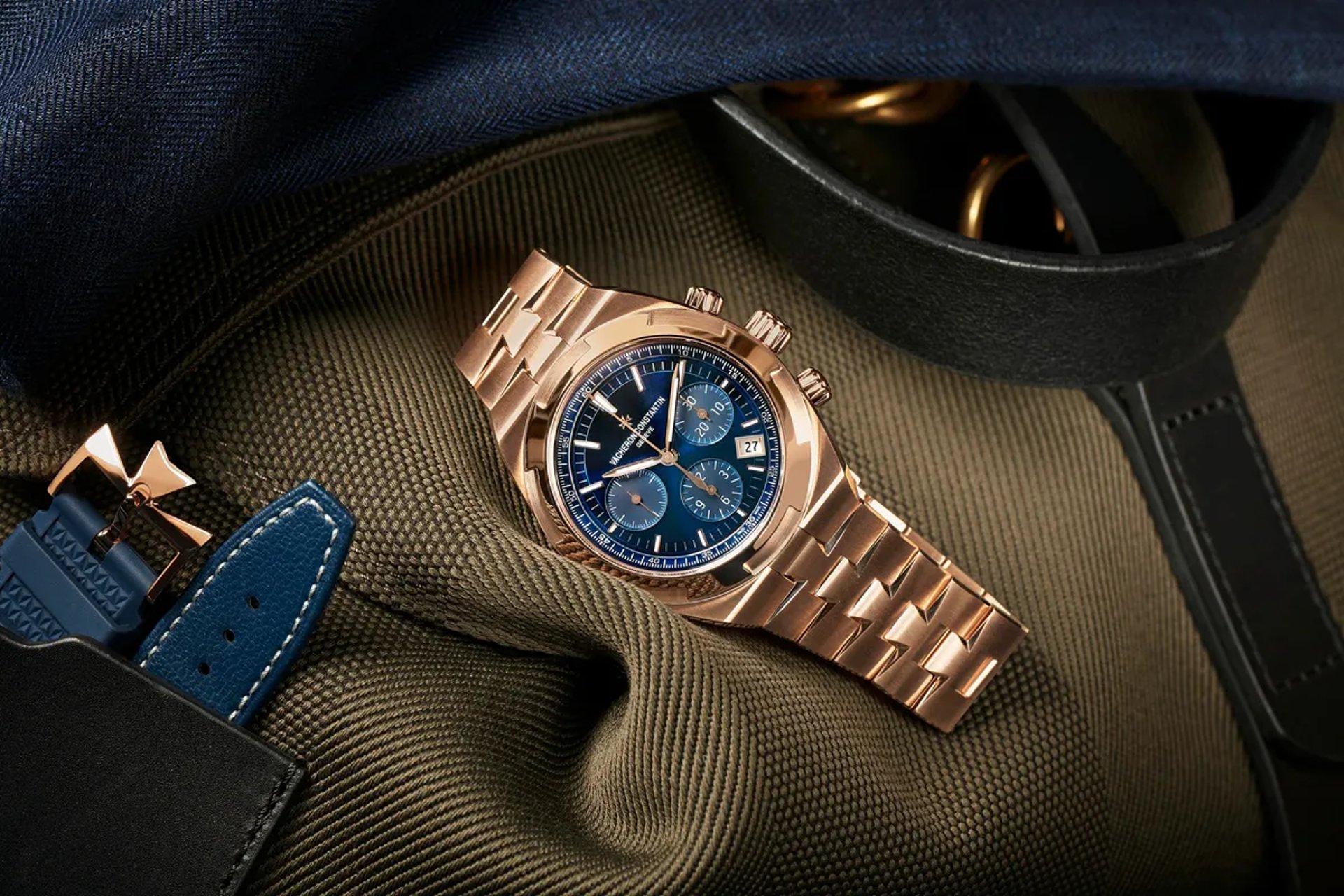 round silver-colored Omega chronograph watch