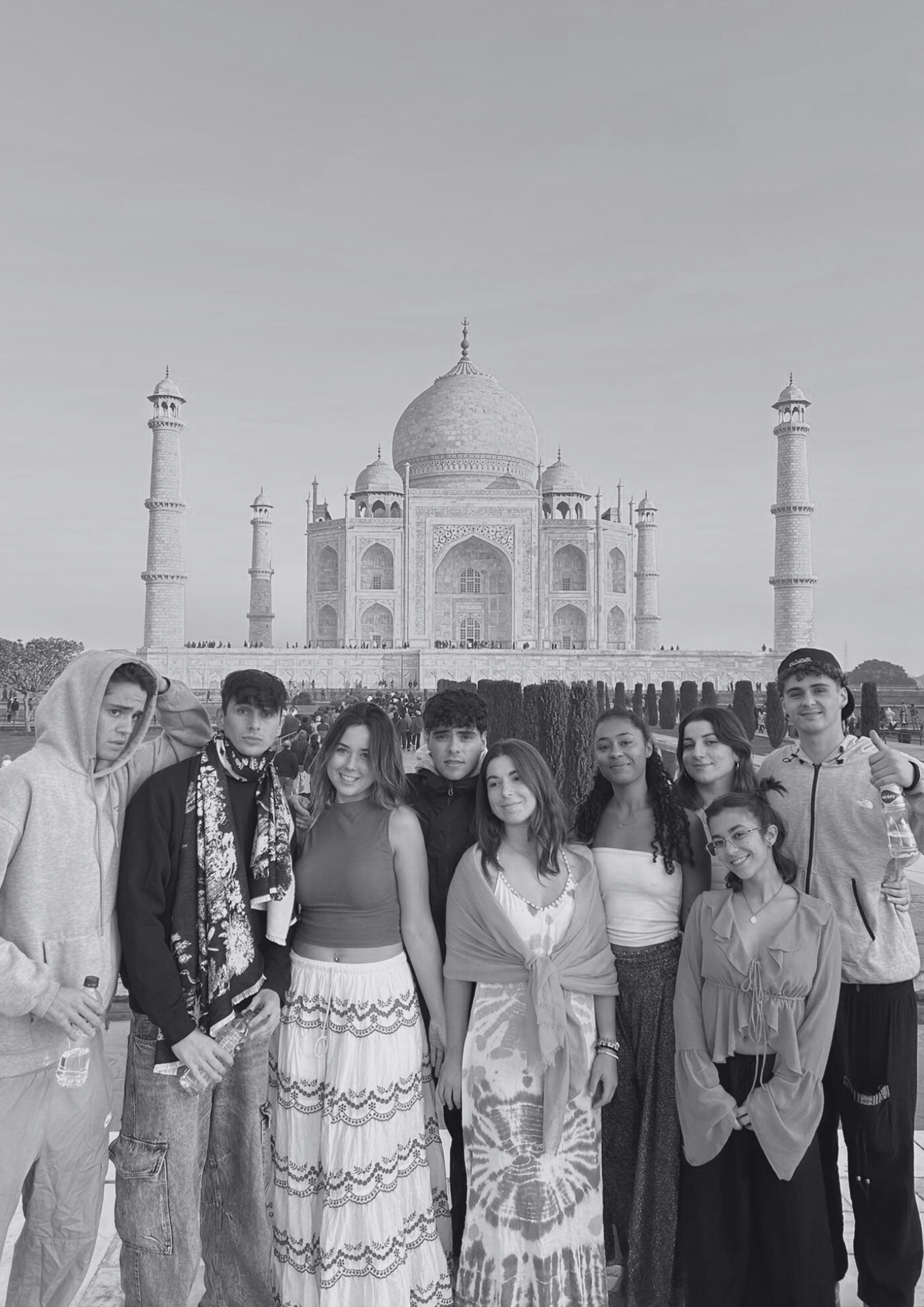 woman wearing yellow long-sleeved dress under white clouds and blue sky during daytime