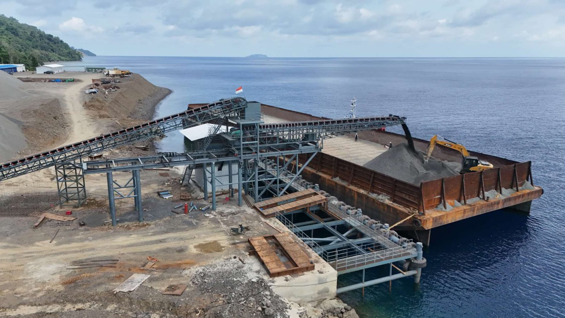 an abstract photo of a curved building with a blue sky in the background