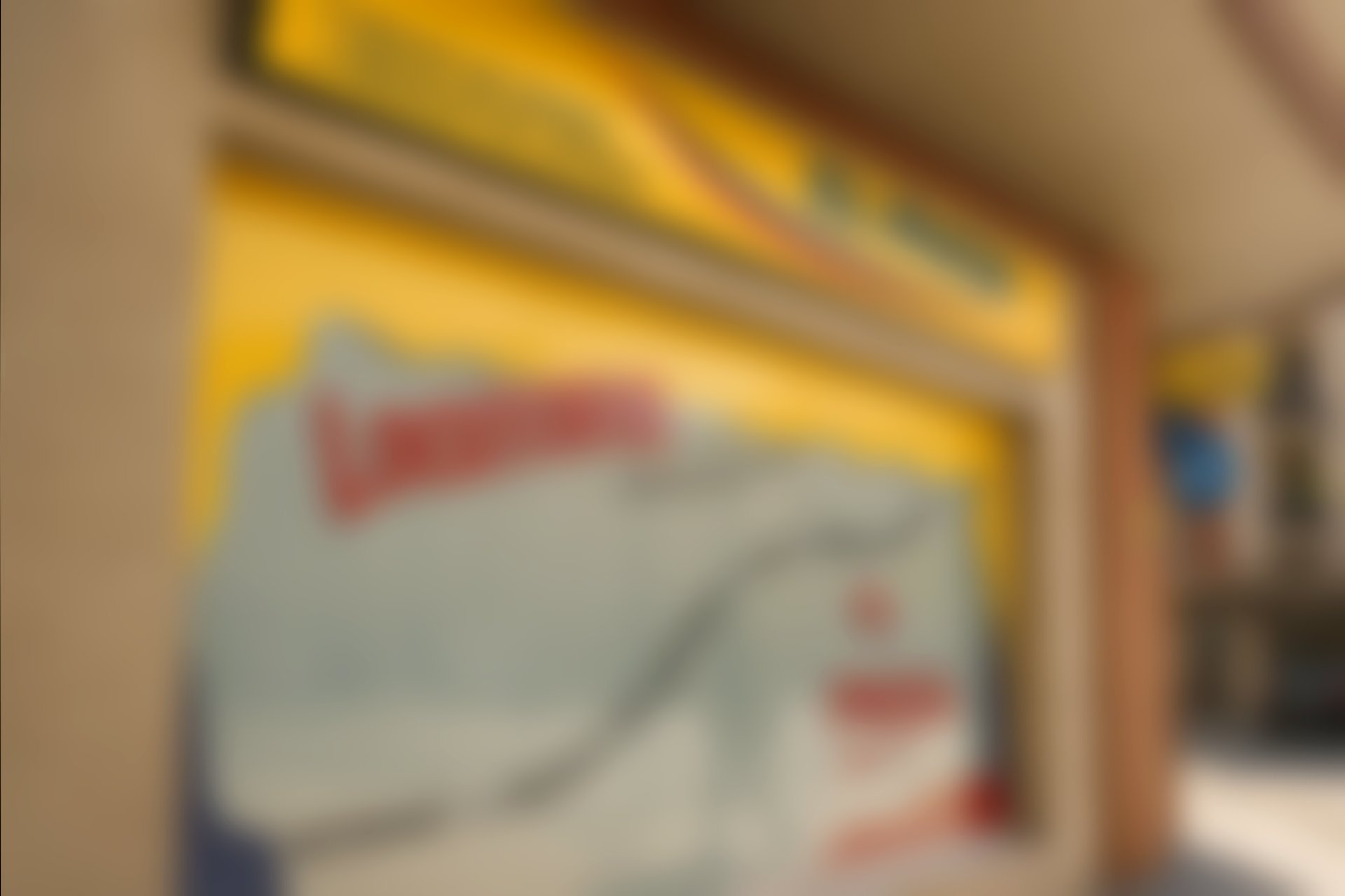 blue wooden door with red and blue wooden chairs