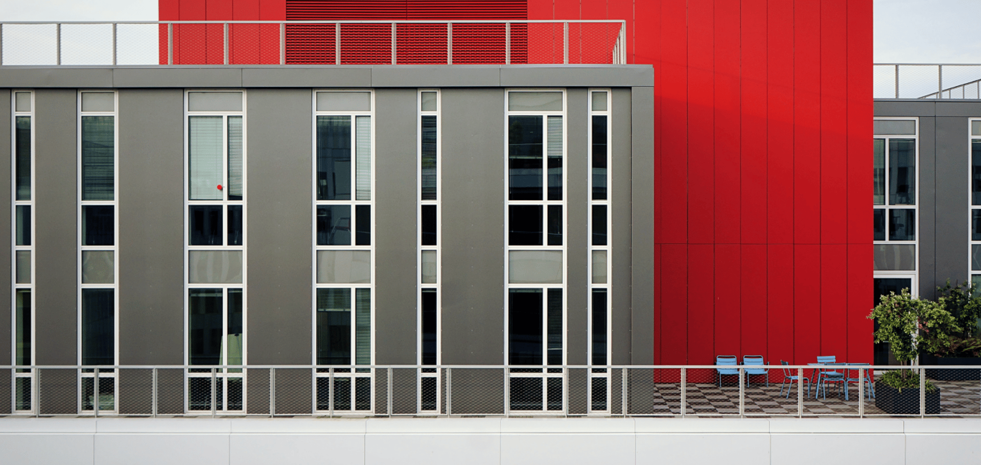 an abstract photo of a curved building with a blue sky in the background