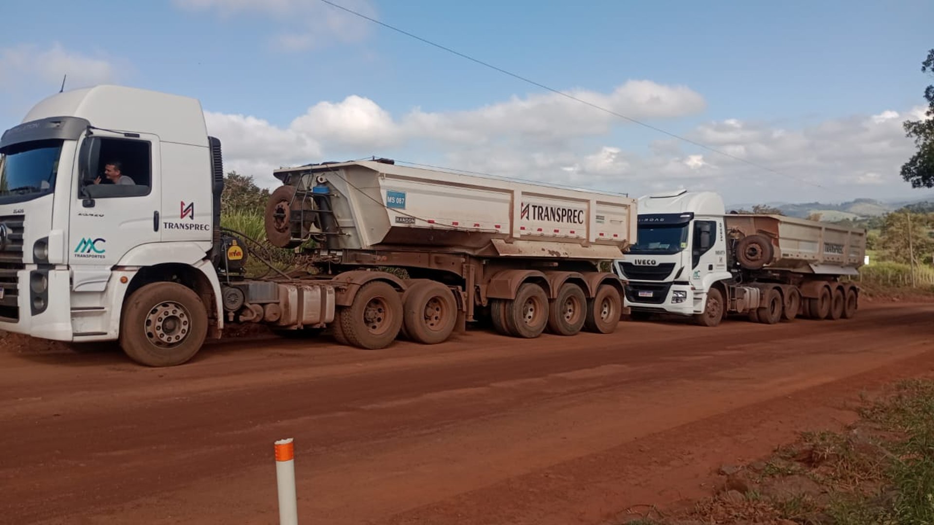 woman wearing yellow long-sleeved dress under white clouds and blue sky during daytime
