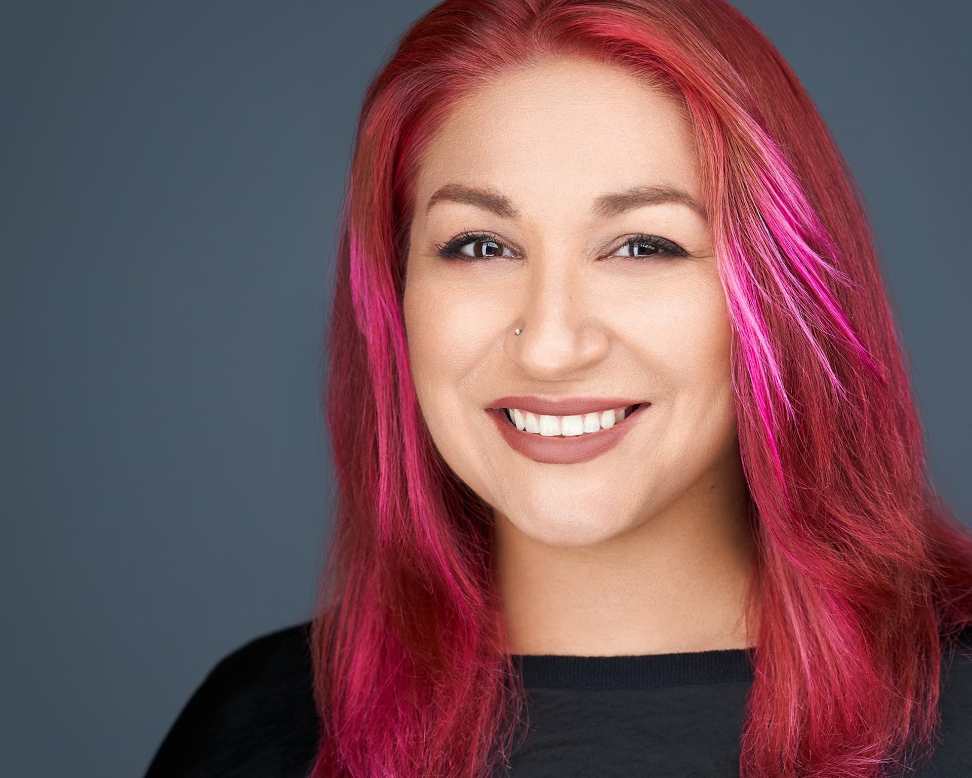 a man in a red suit and a man in a black shirt