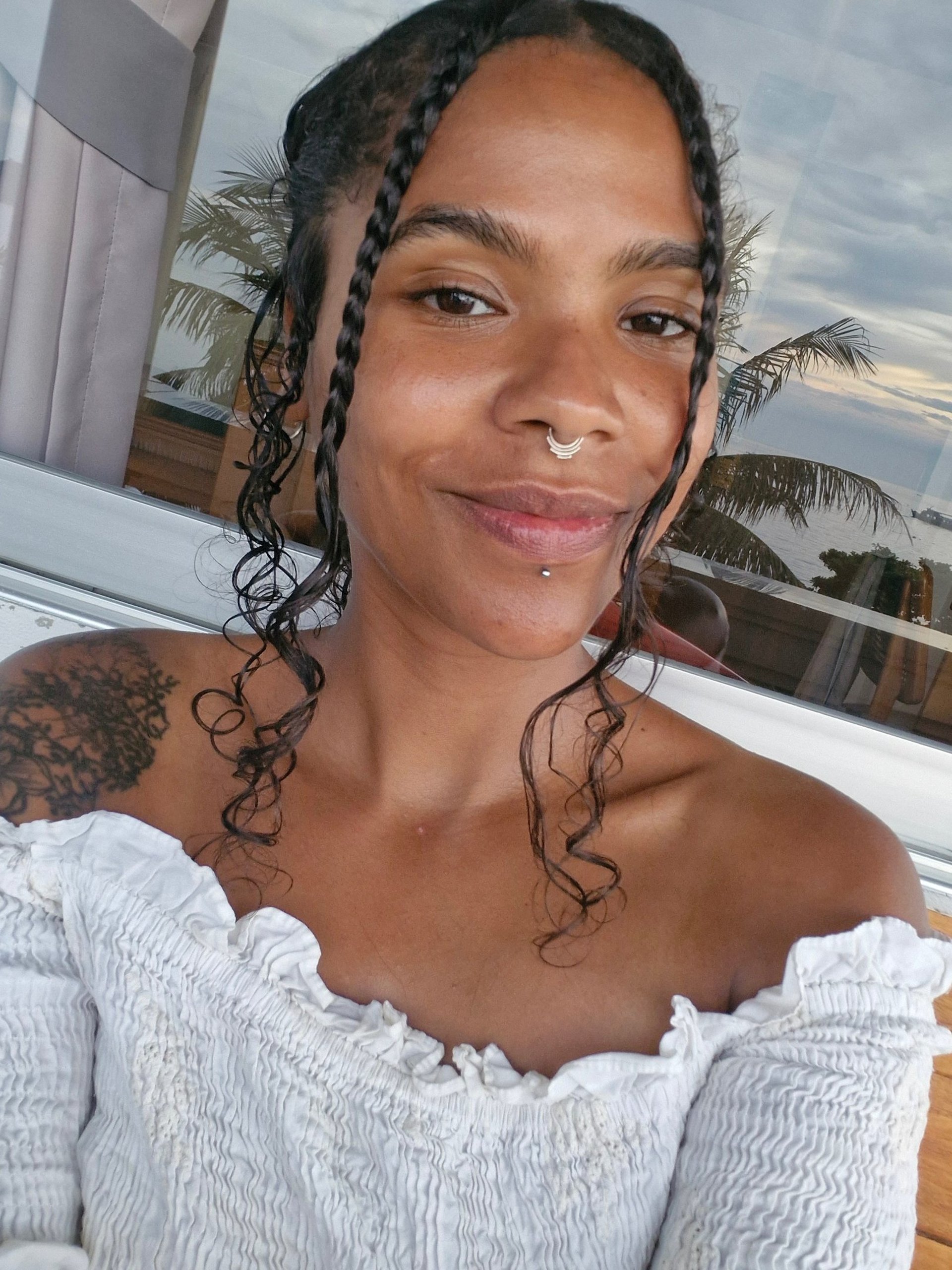 an abstract photo of a curved building with a blue sky in the background