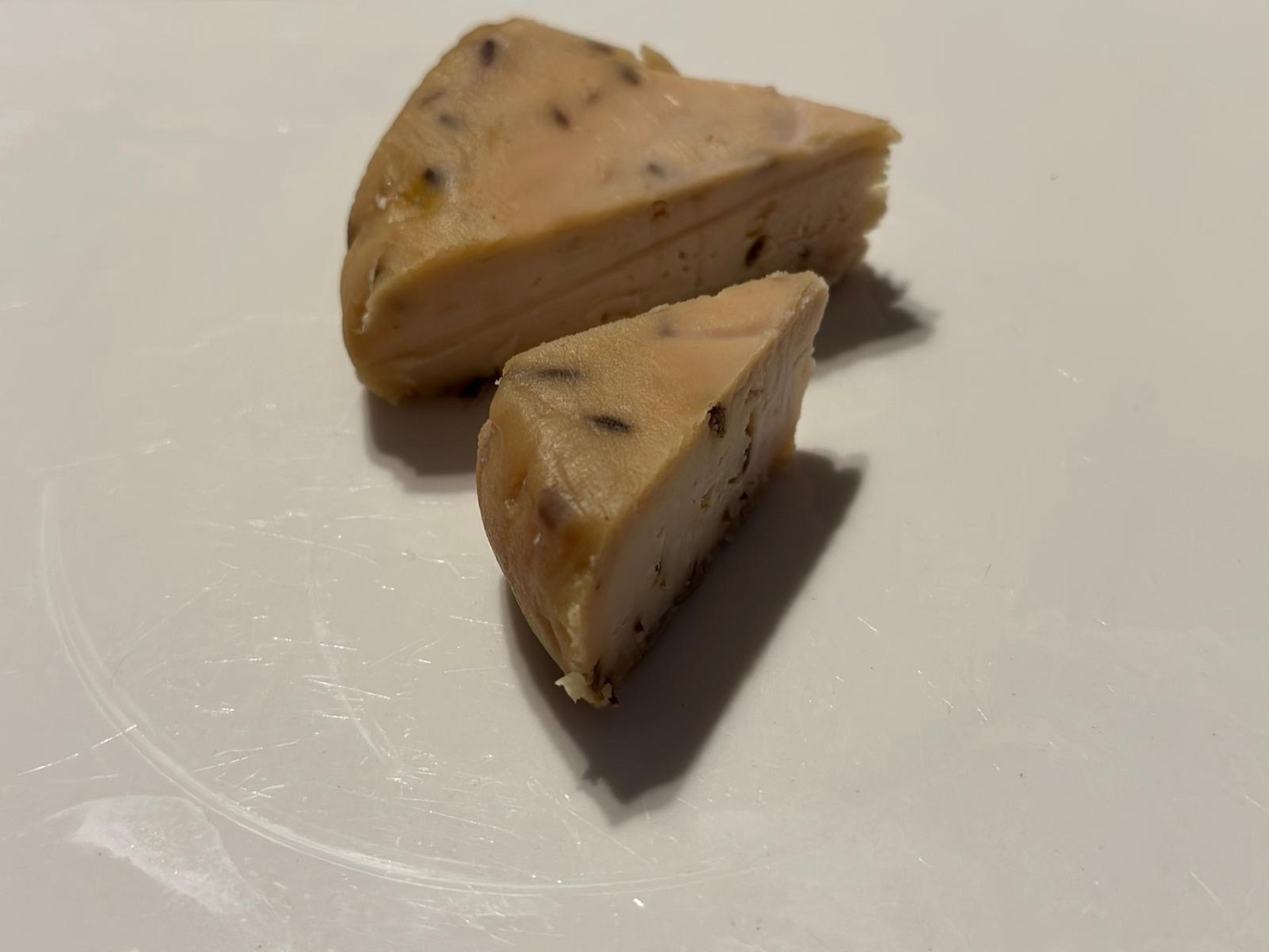 an abstract photo of a curved building with a blue sky in the background