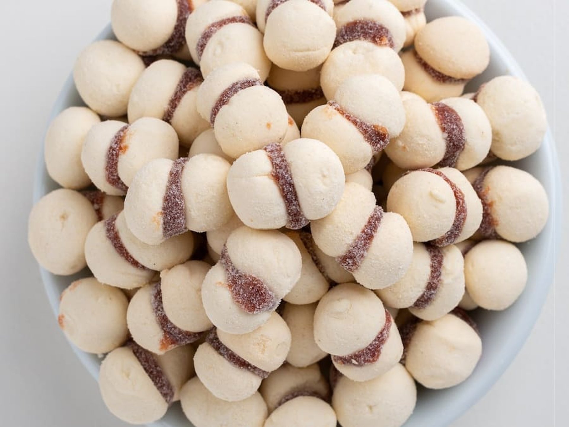 woman wearing yellow long-sleeved dress under white clouds and blue sky during daytime