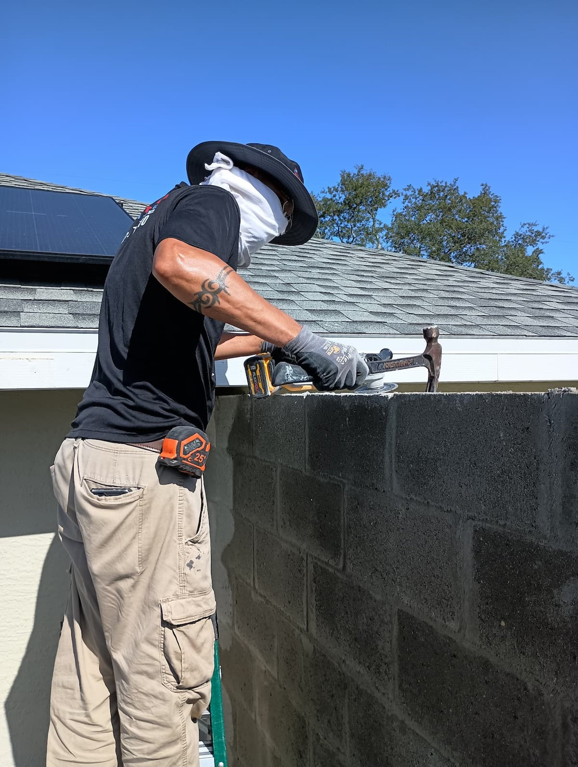 person holding black and yellow nike gloves