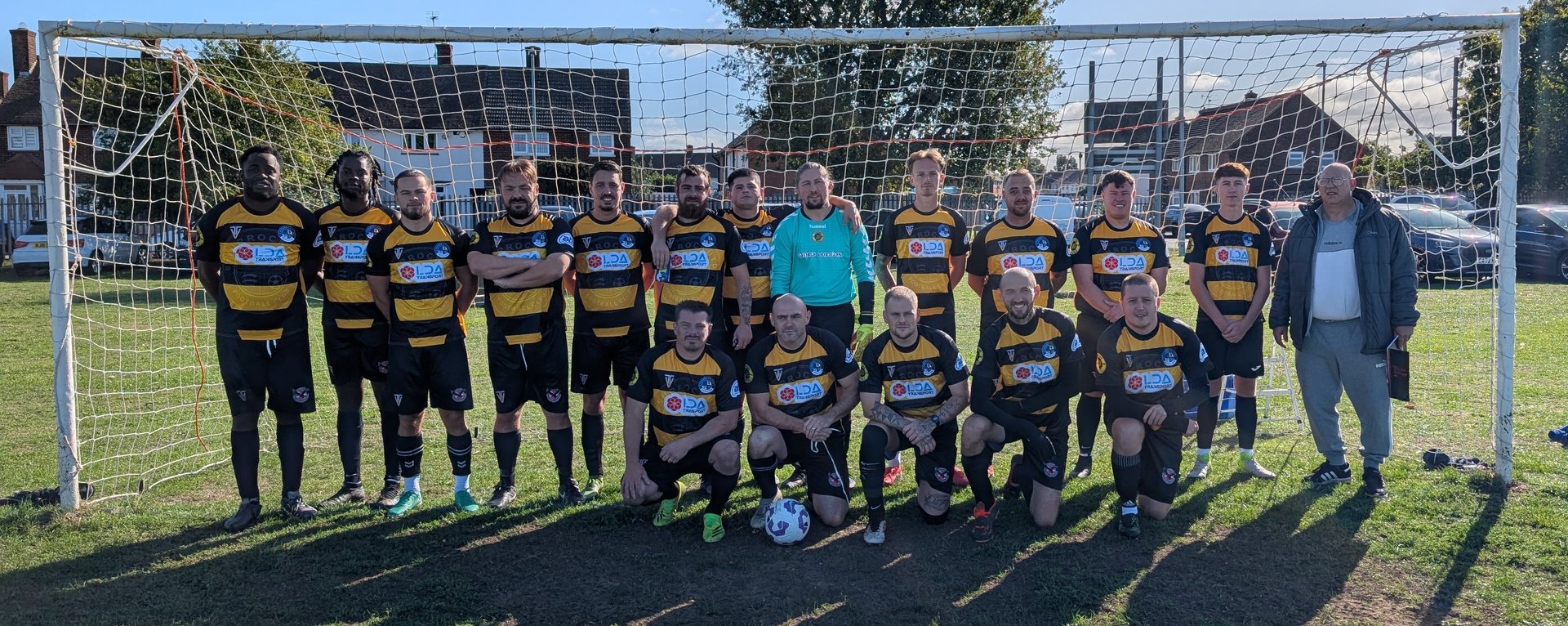 black and brown leather padded tub sofa