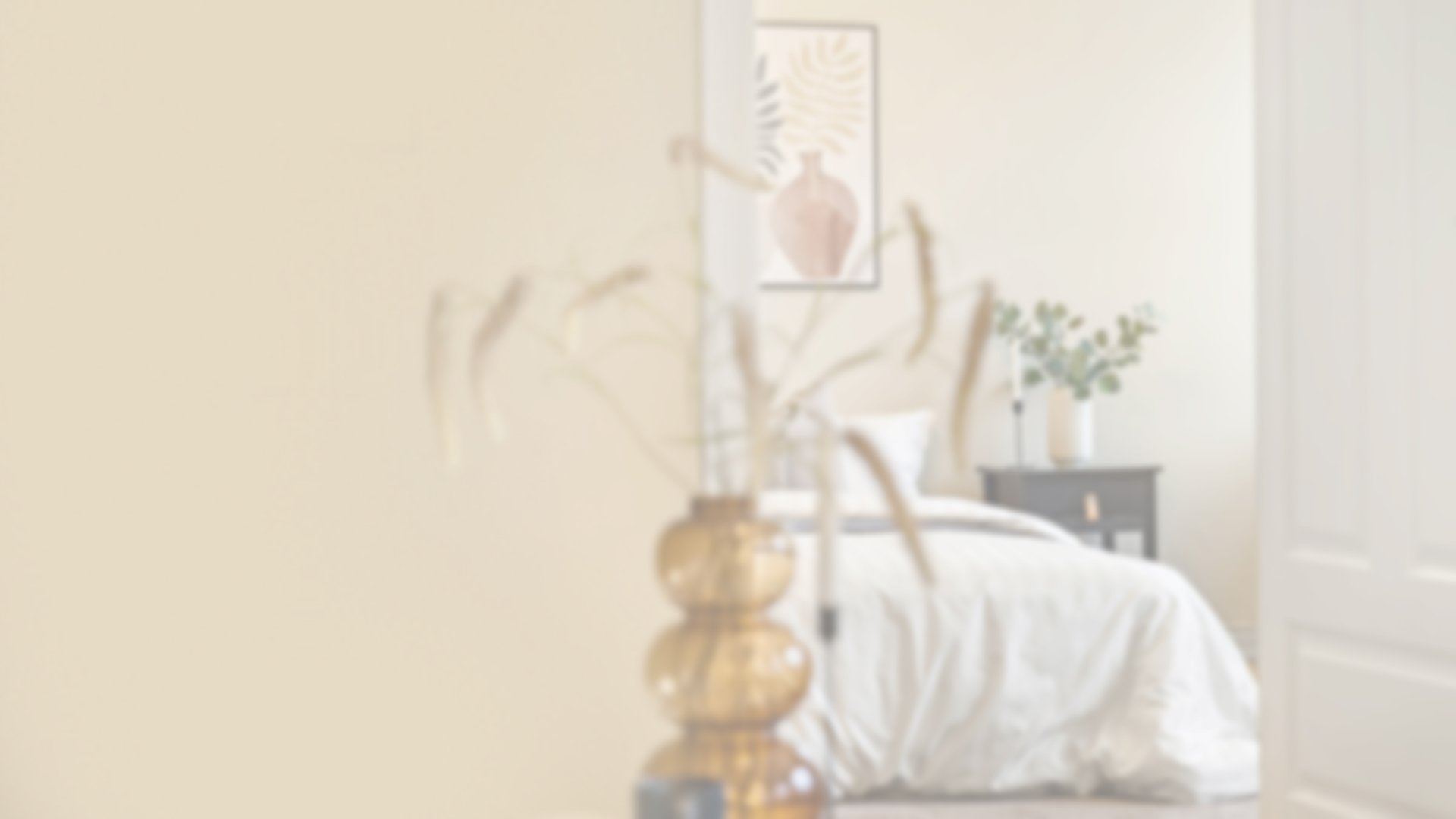 brown wooden bed frame with white cover beside brown wooden nightstand