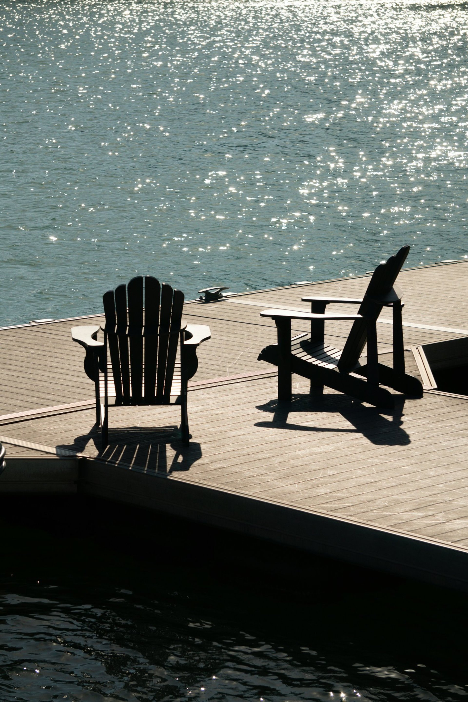 brown wooden dock on calm body ofwater