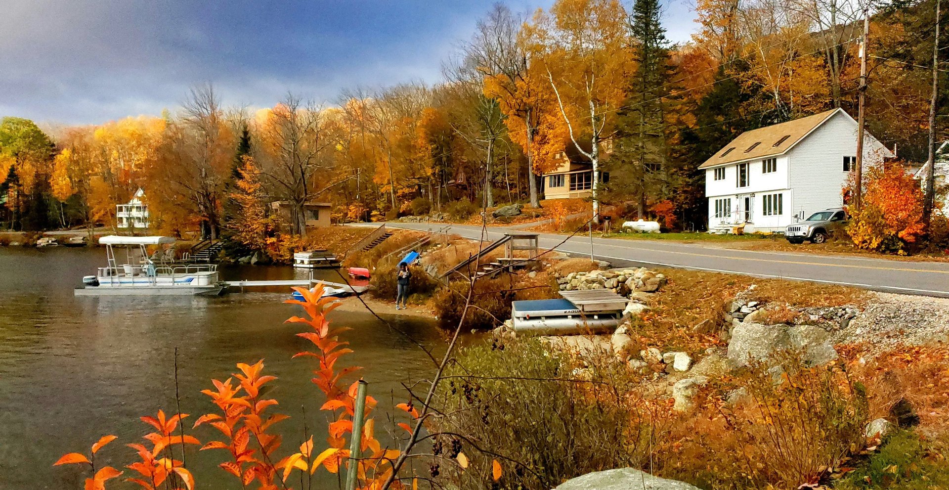 white boat near lake dock