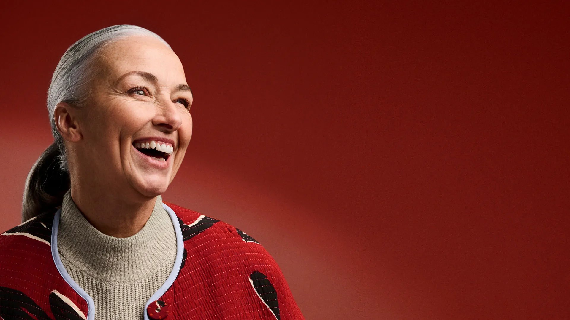 an abstract photo of a curved building with a blue sky in the background