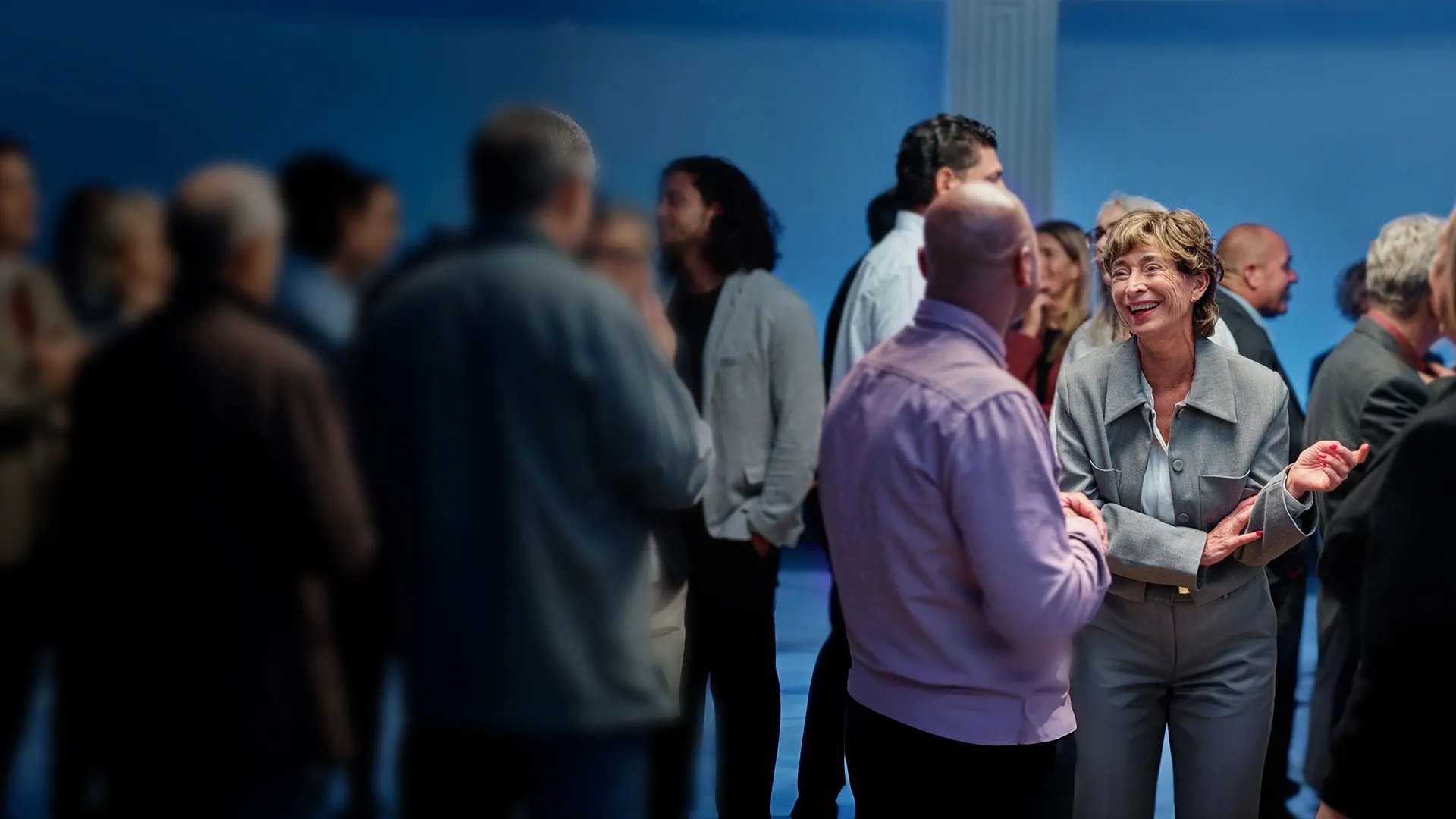 an abstract photo of a curved building with a blue sky in the background