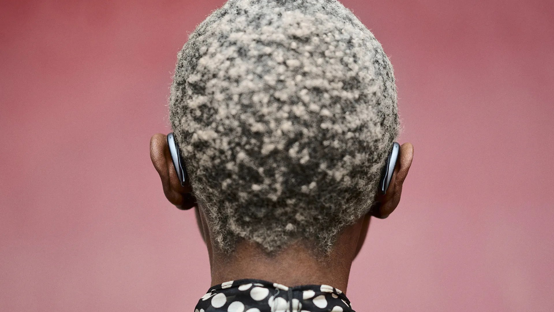 an abstract photo of a curved building with a blue sky in the background