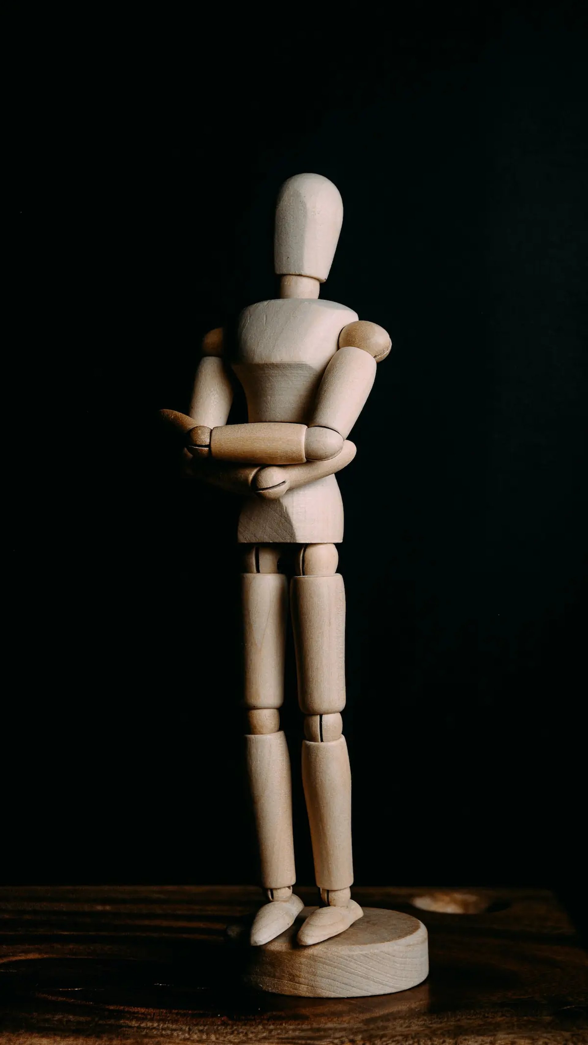 brown wooden human form figurine