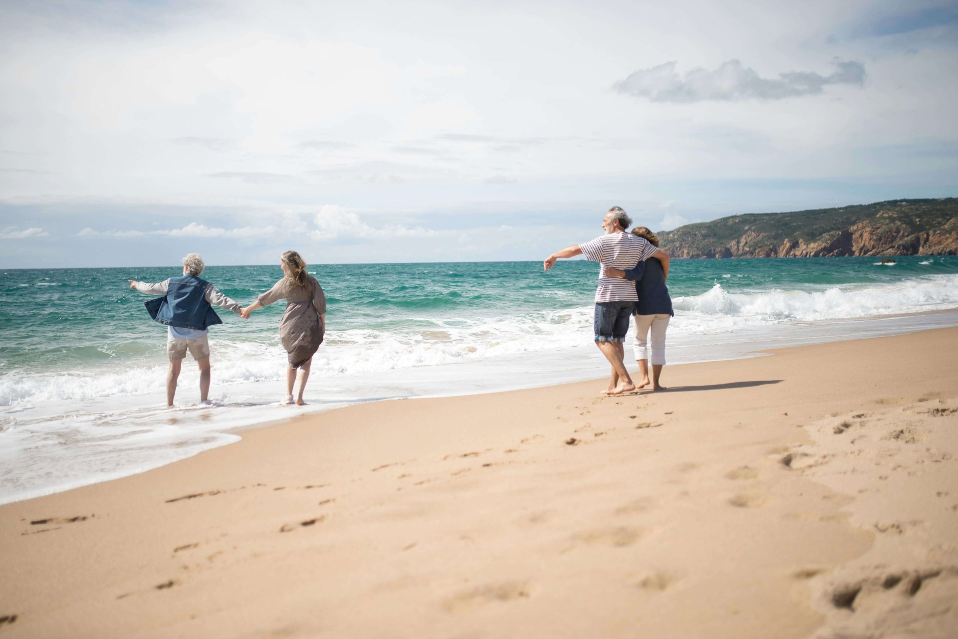 group of people playing on beach