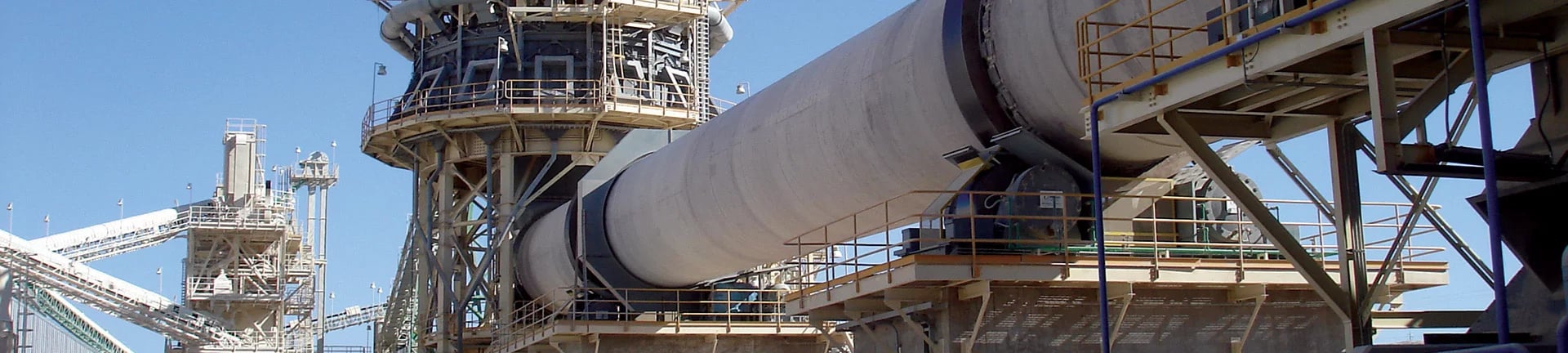 woman wearing yellow long-sleeved dress under white clouds and blue sky during daytime