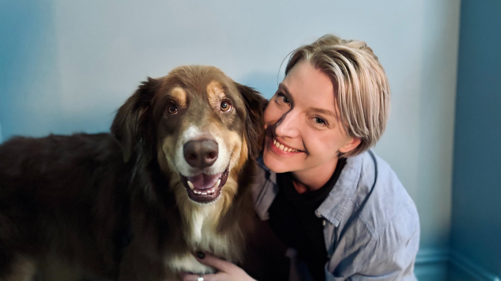 an abstract photo of a curved building with a blue sky in the background