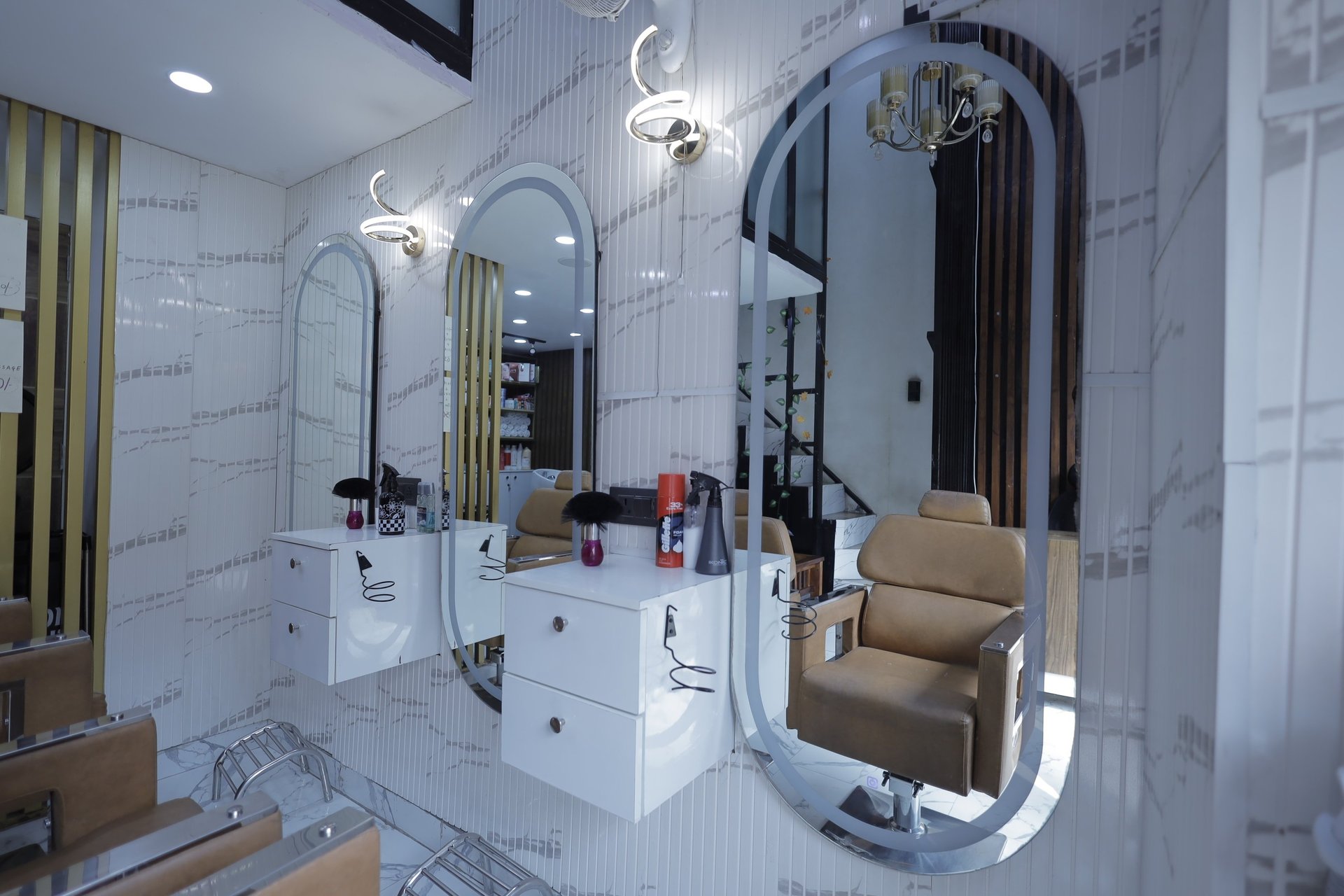 a woman getting her hair cut by a hair stylist