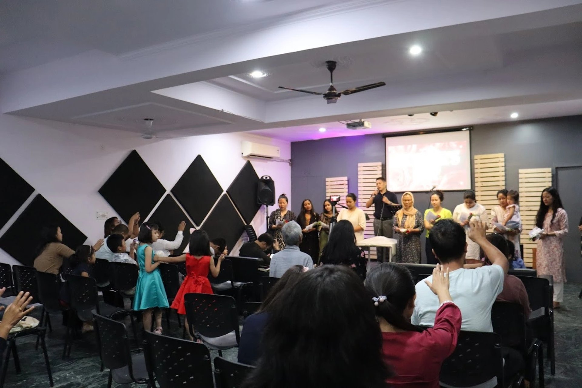 a person riding a snowboard down a snow covered slope
